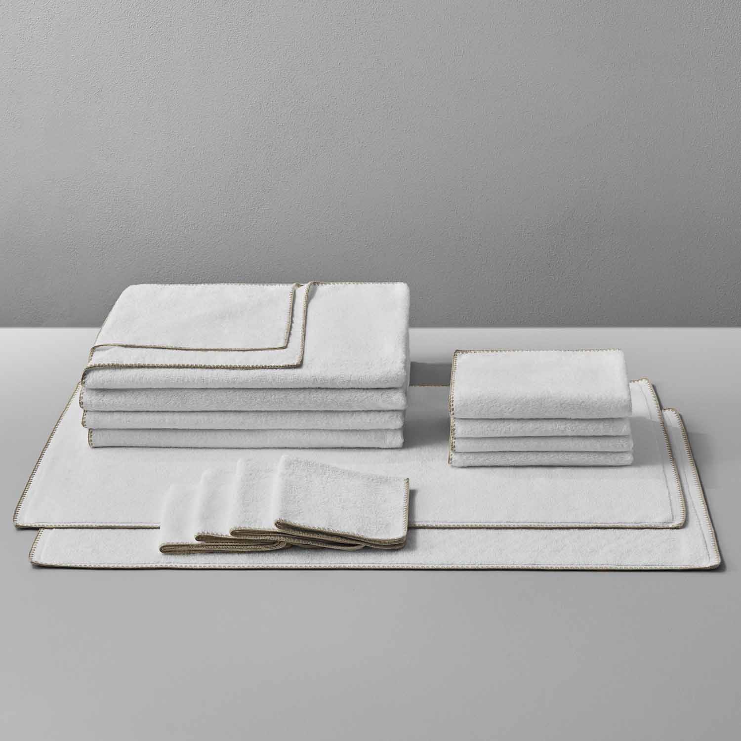 Bordado Towel Sand Trim set featuring plush, space-saving towels that reduce wash/dry cycle water and energy use.