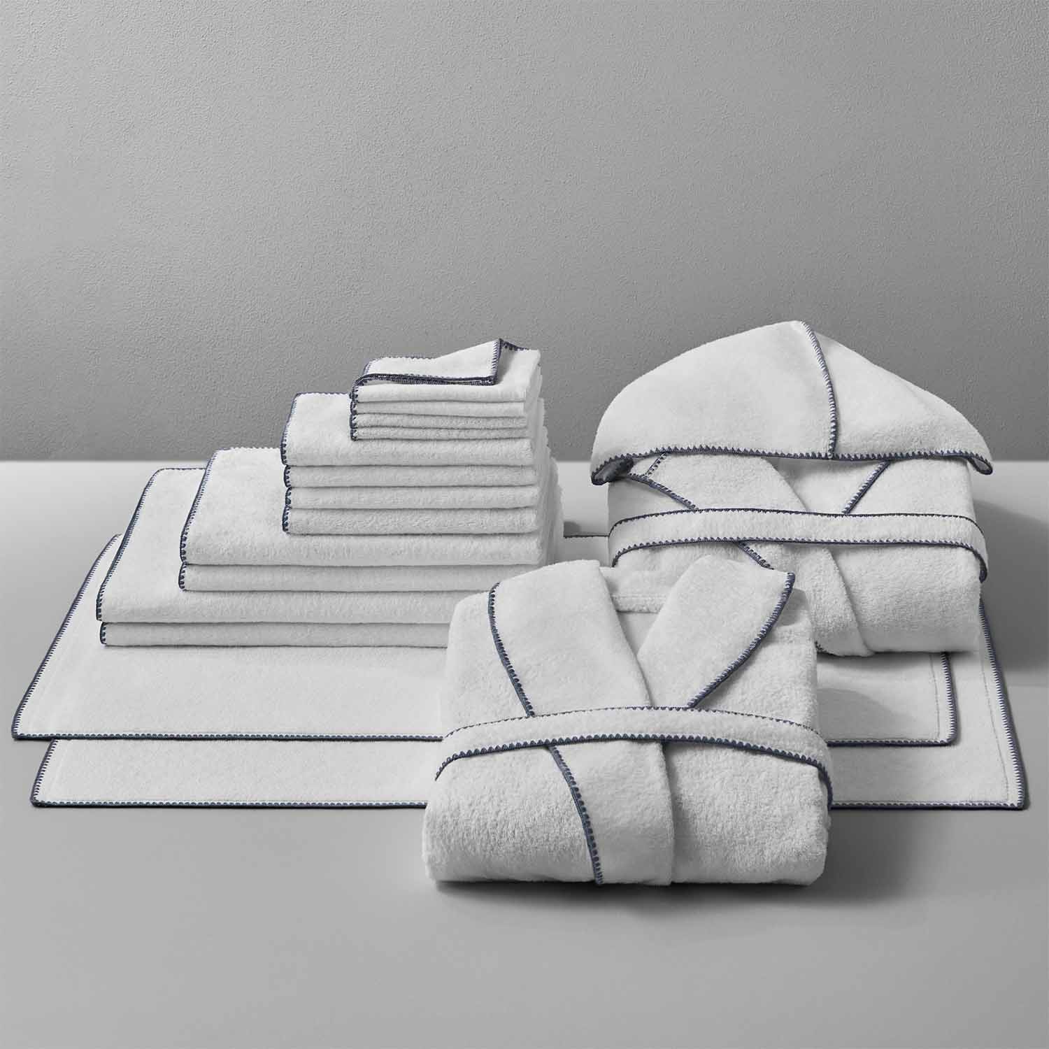 Bountiful Bordado Bundle featuring plush, ultra-absorbent towels with millennial-grey stitching, perfect for saving space and energy.
