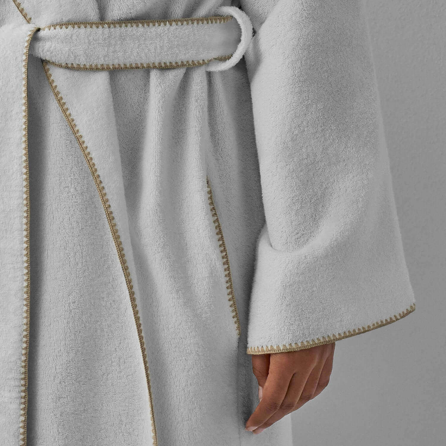 Bordado shawl with sand trim showcasing light-weight comfort and plush texture, perfect for lounging.