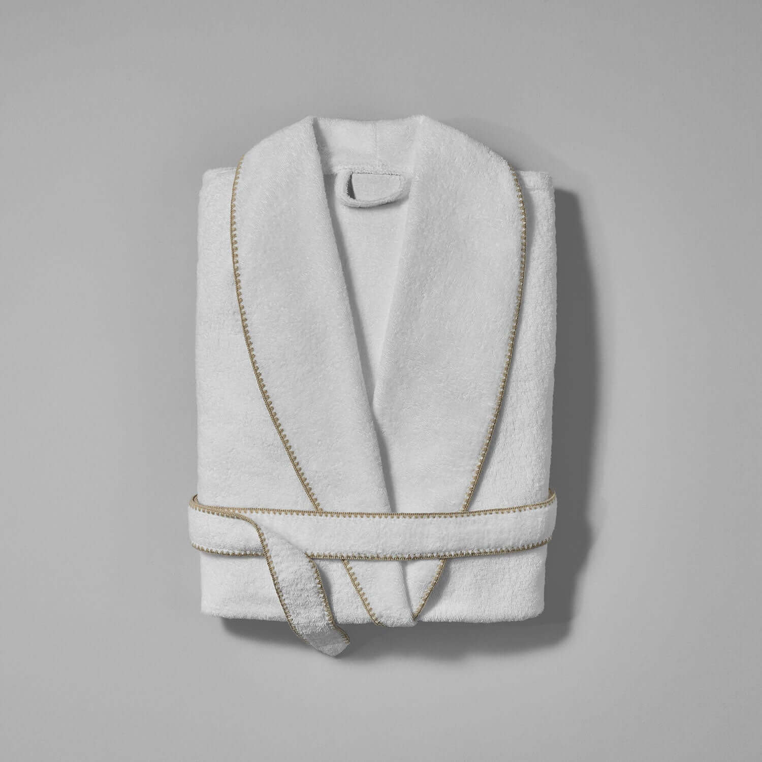 Elegant Bordado Shawl with sand trim, showcasing moisture-absorbing plush weave and self-tie belt for ultimate comfort.