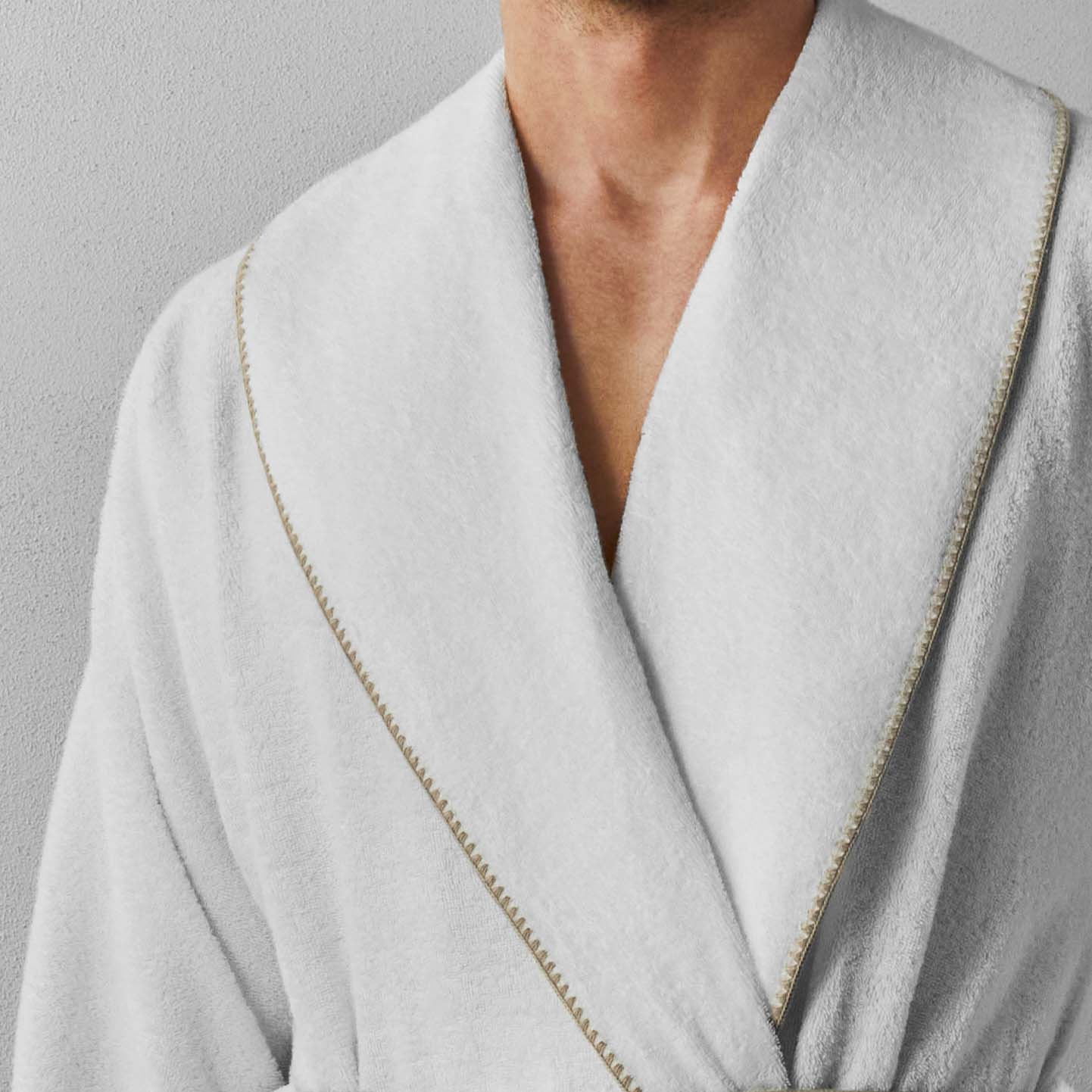 Bordado shawl with sand trim, showcasing plush texture and sleek design, perfect for comfort and style.