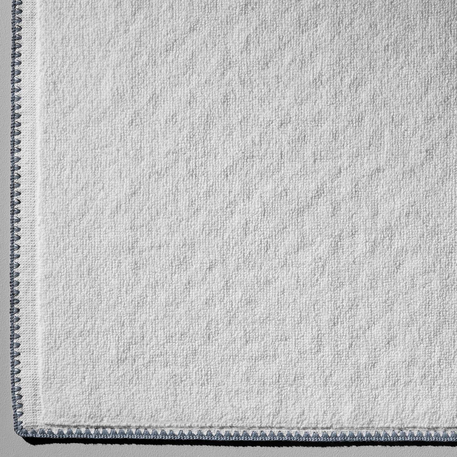 Bountiful Bordado Bundle towel featuring ultra-absorbent, thin plush design with millennial-grey stitching.