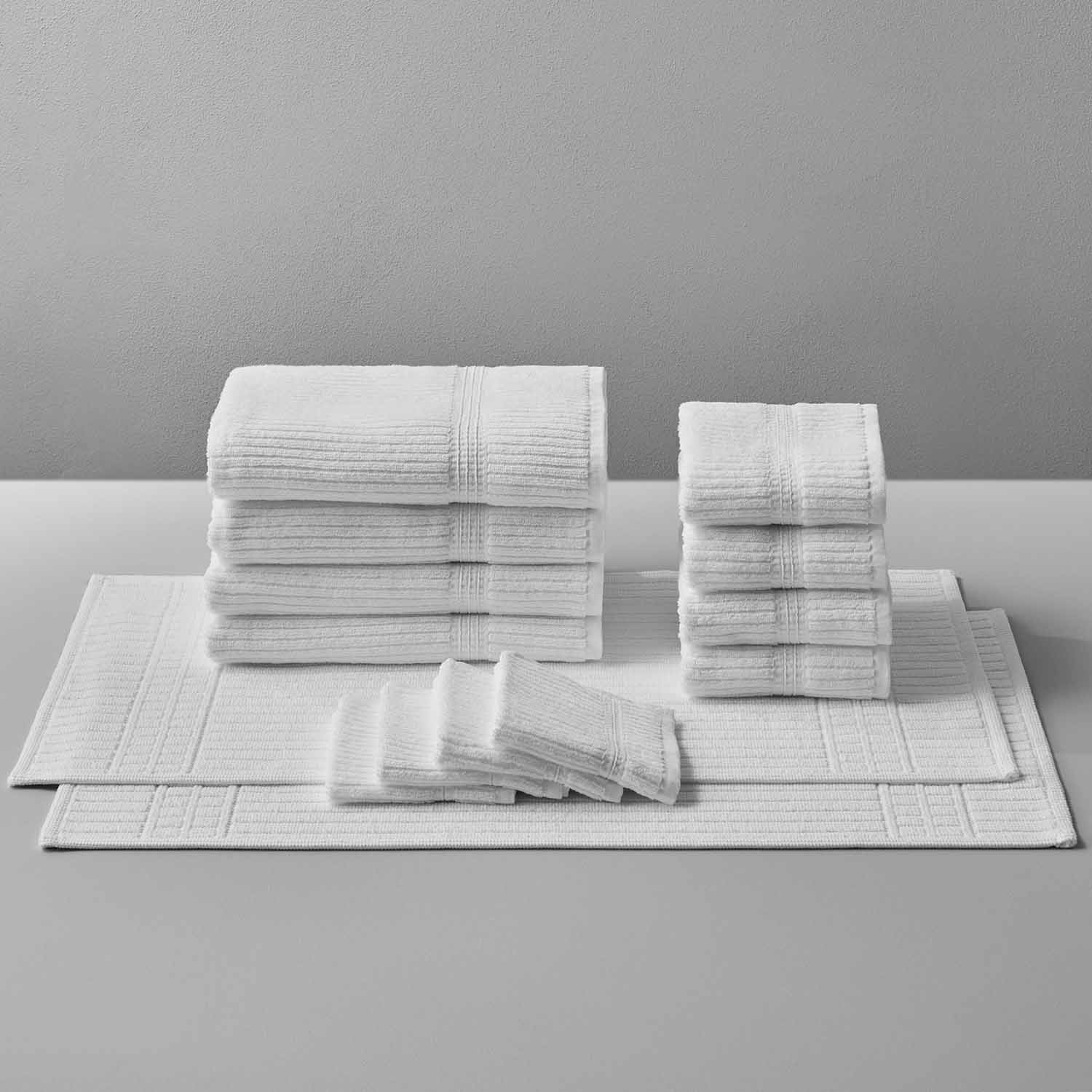 Canelado towels stacked neatly, perfect for daily spa rituals at home, offering luxury and comfort.