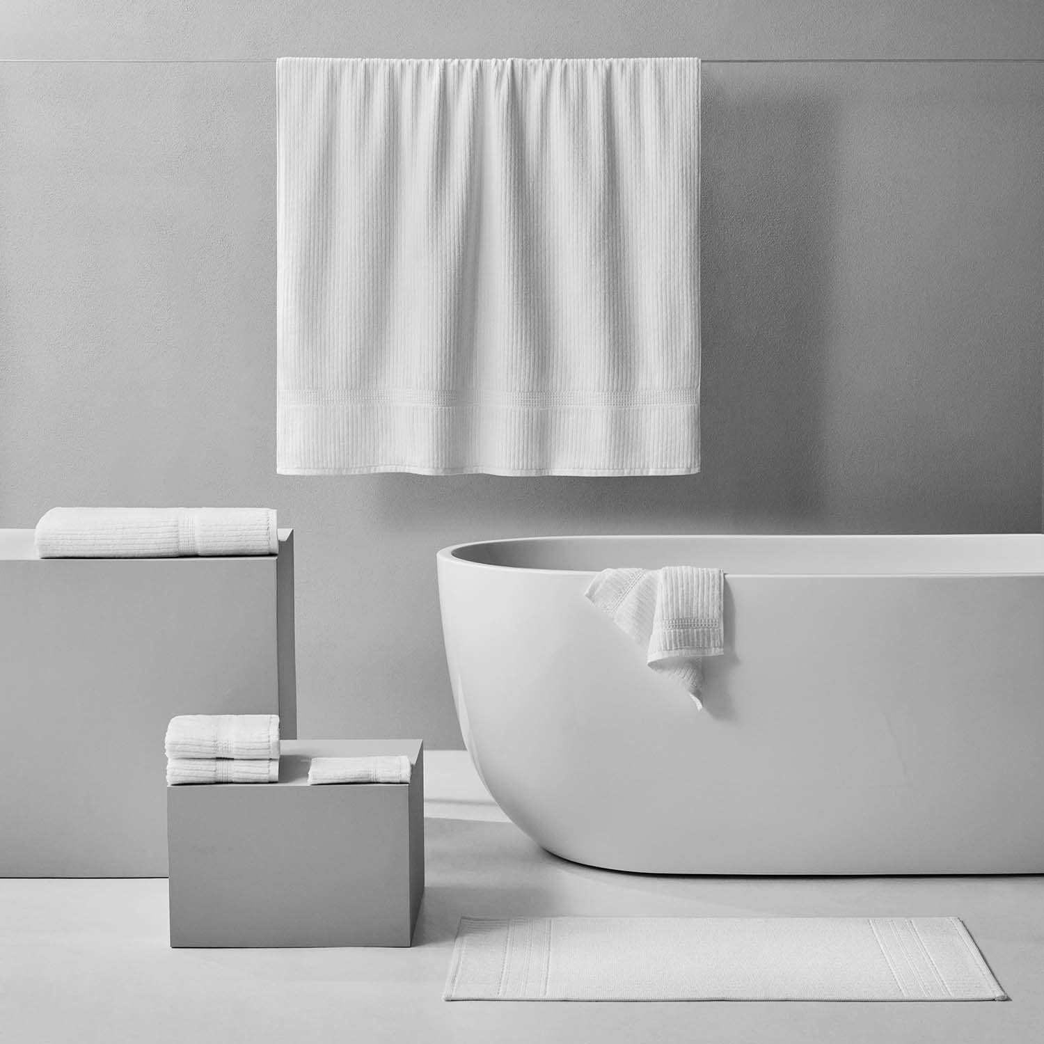 Canelado Towel hanging in a modern bathroom, ideal for daily spa rituals at home, enhancing your relaxation experience.