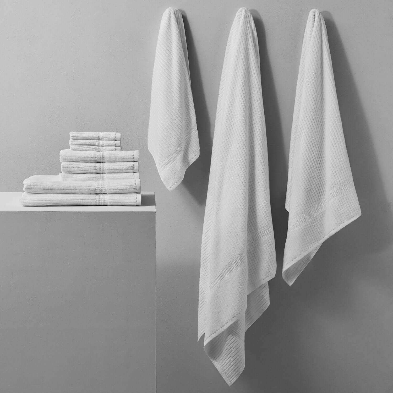 Canelado Towel displayed elegantly, perfect for daily spa rituals, featuring a textured design in soft white hues.