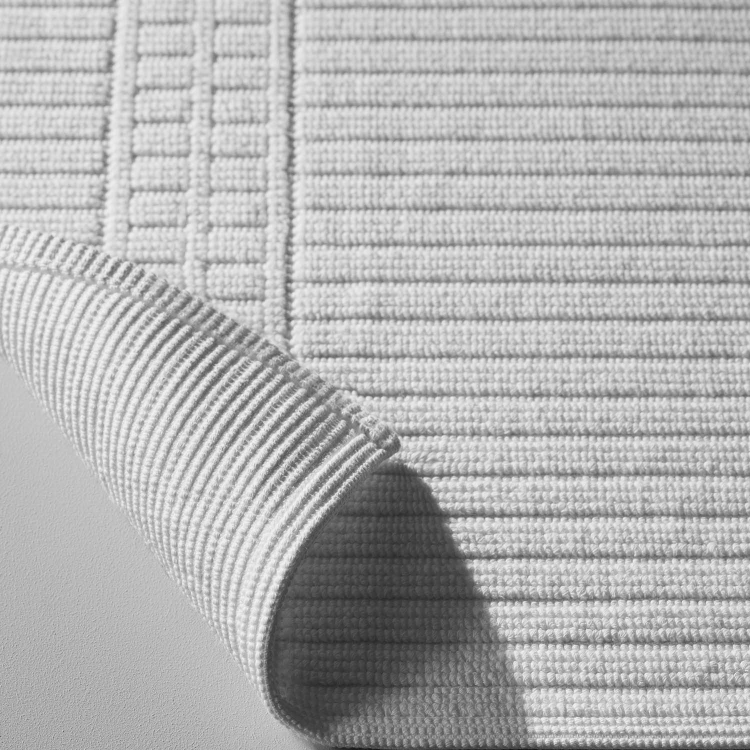 Textured Canelado mat showcasing detailed craftsmanship, perfect for luxury hotels and spas. Elegant and durable for premium comfort.