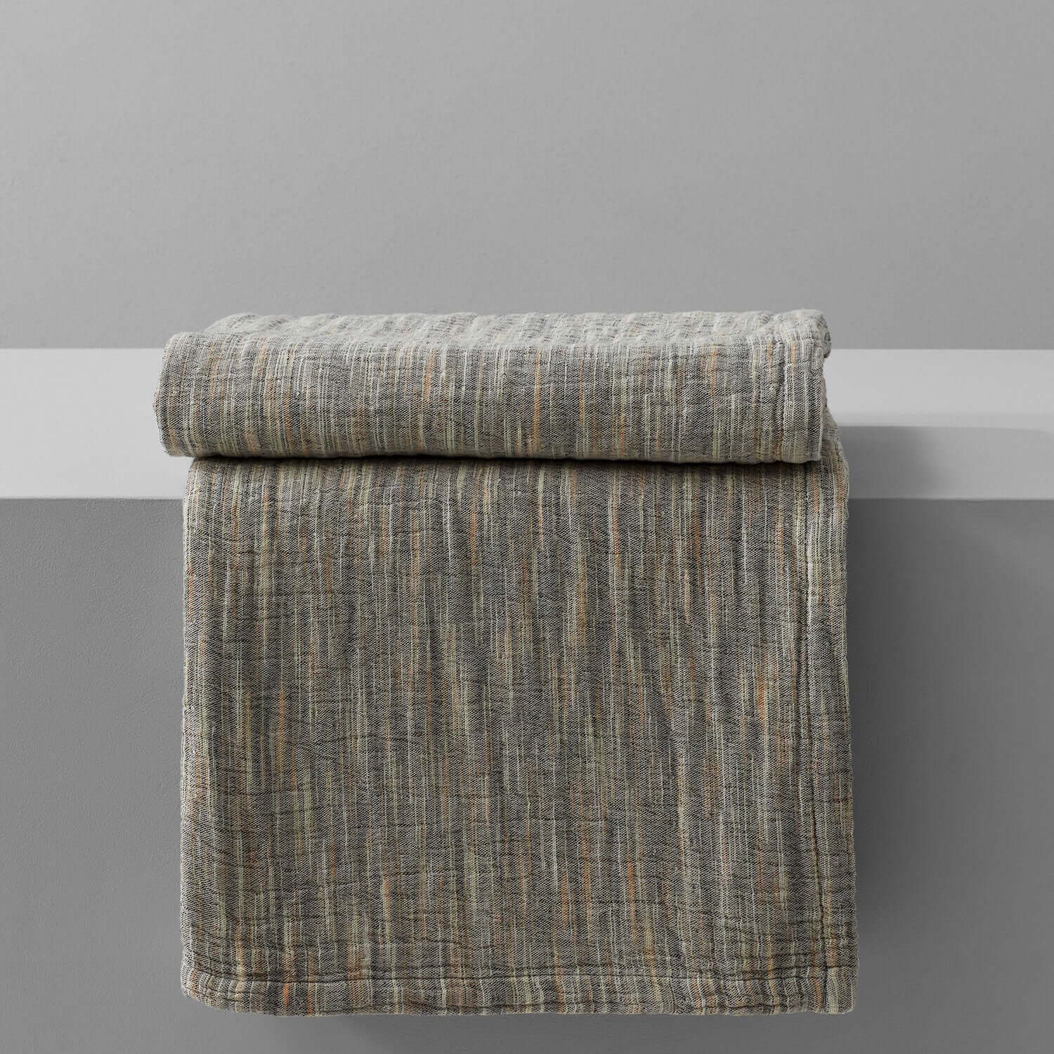 Artisanal printed yarn blanket, crafted by skilled artisans, perfect for living areas or massage beds.