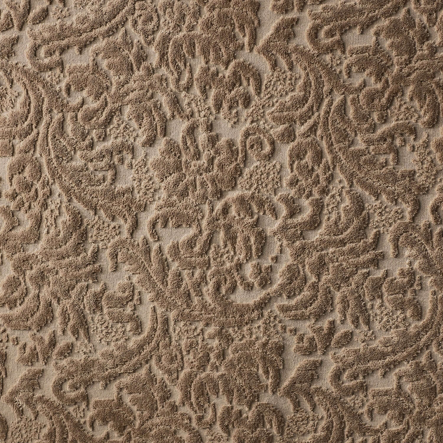 Close-up of a chocolate Baroque blanket showcasing a rich velour pattern, perfect for luxurious bedding or outdoor use.