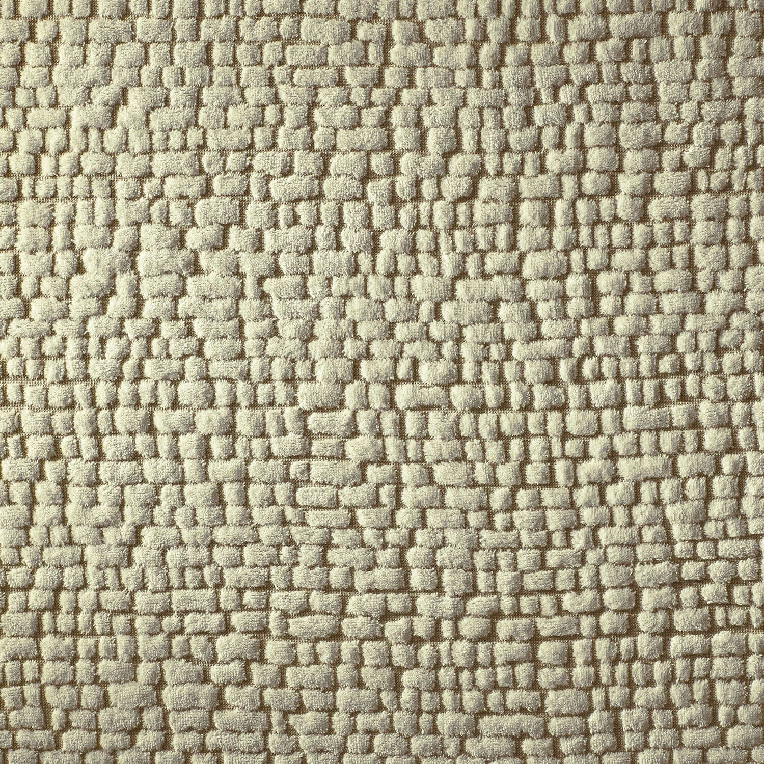 Natural pebble texture of the Pebble Blanket Sand, made from 100% cotton terry for softness and durability.