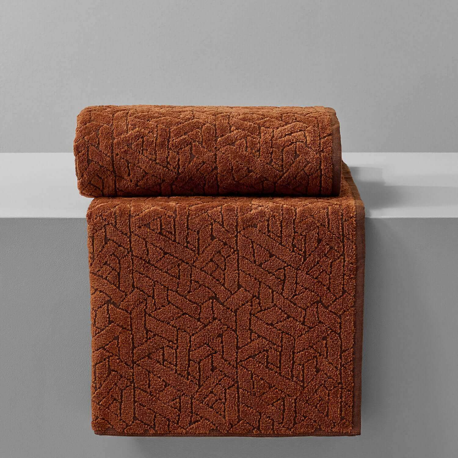Wabi Sabi blanket in rich brown, showcasing minimalist design and luxurious texture on a neutral background.
