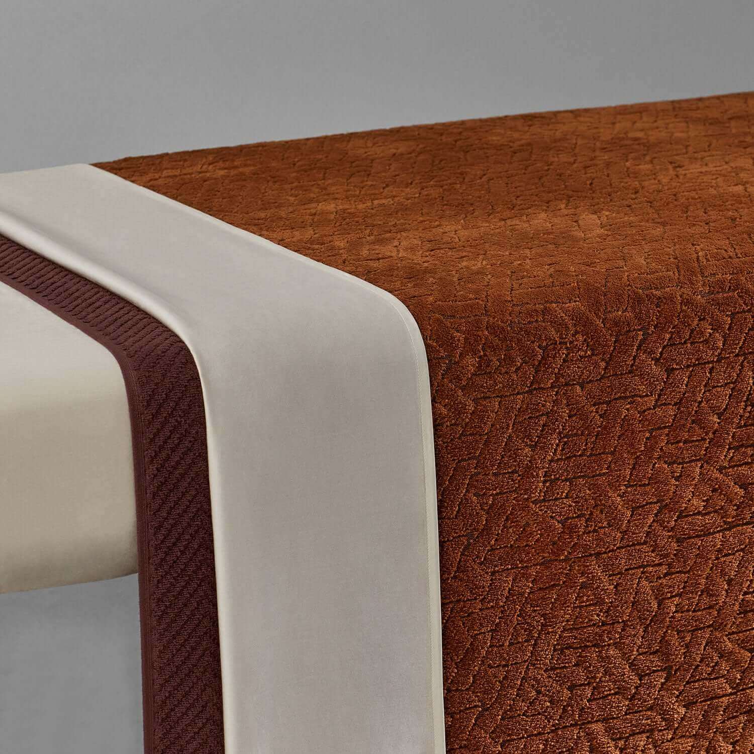 Elegant Wabi Sabi blanket with rich textures in warm brown and cream colors, enhancing minimalist decor.