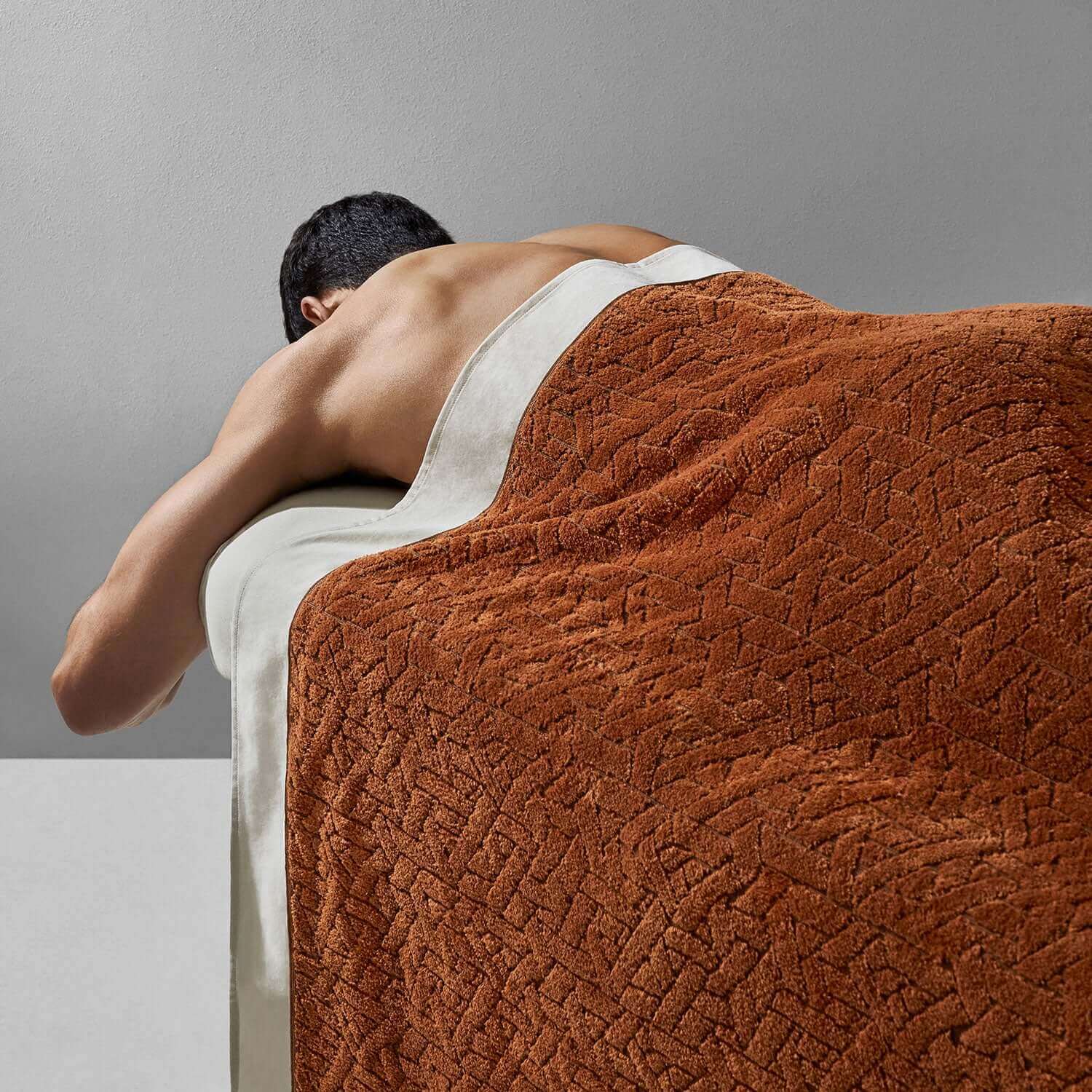 Wabi Sabi blanket providing comfort and luxury in a minimalist spa setting.