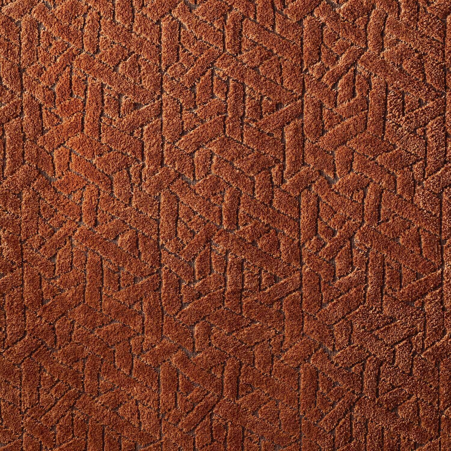 Textured brown fabric featuring a geometric pattern, exemplifying artisanal craftsmanship and minimalist design.