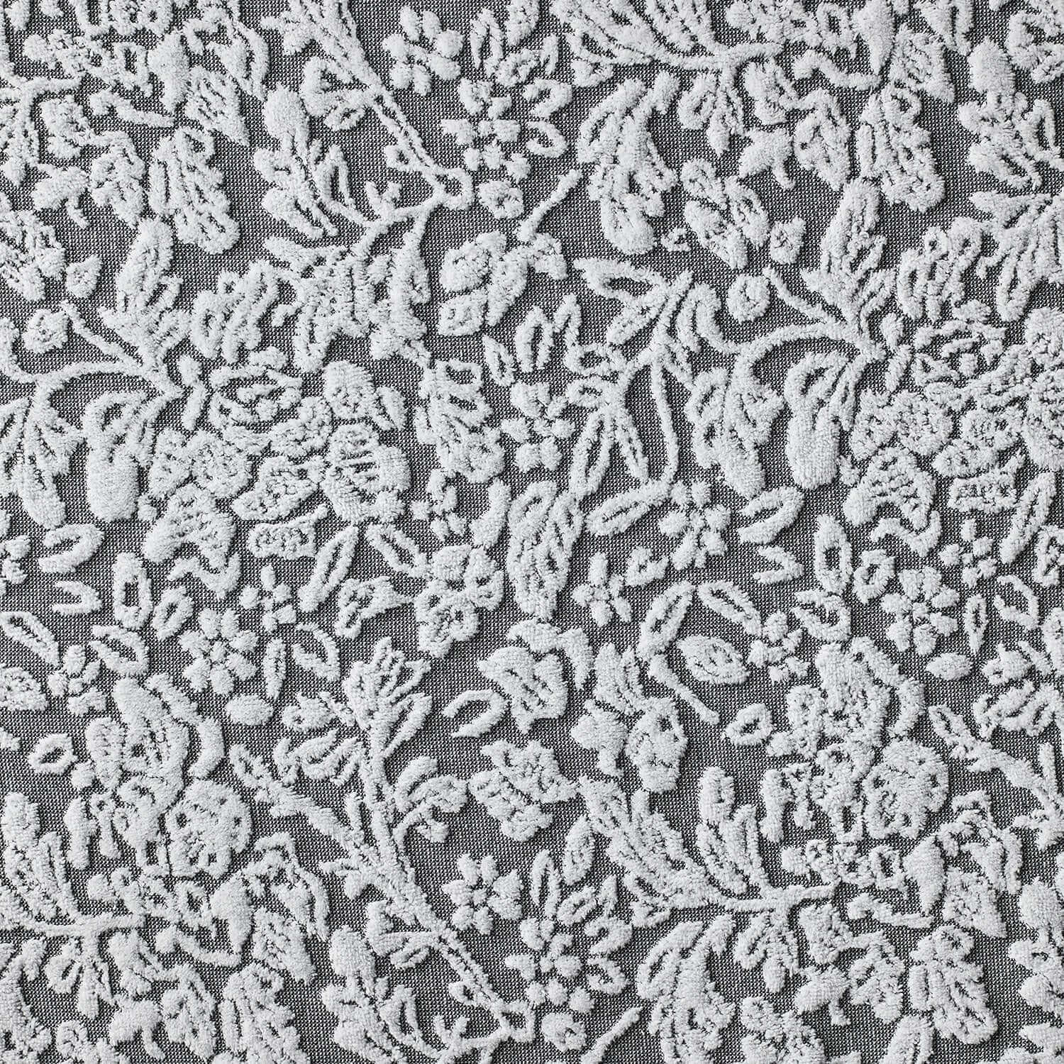 Grey floral jacquard weave fabric with white yarn-dyed detailing, perfect for machine washable blankets.