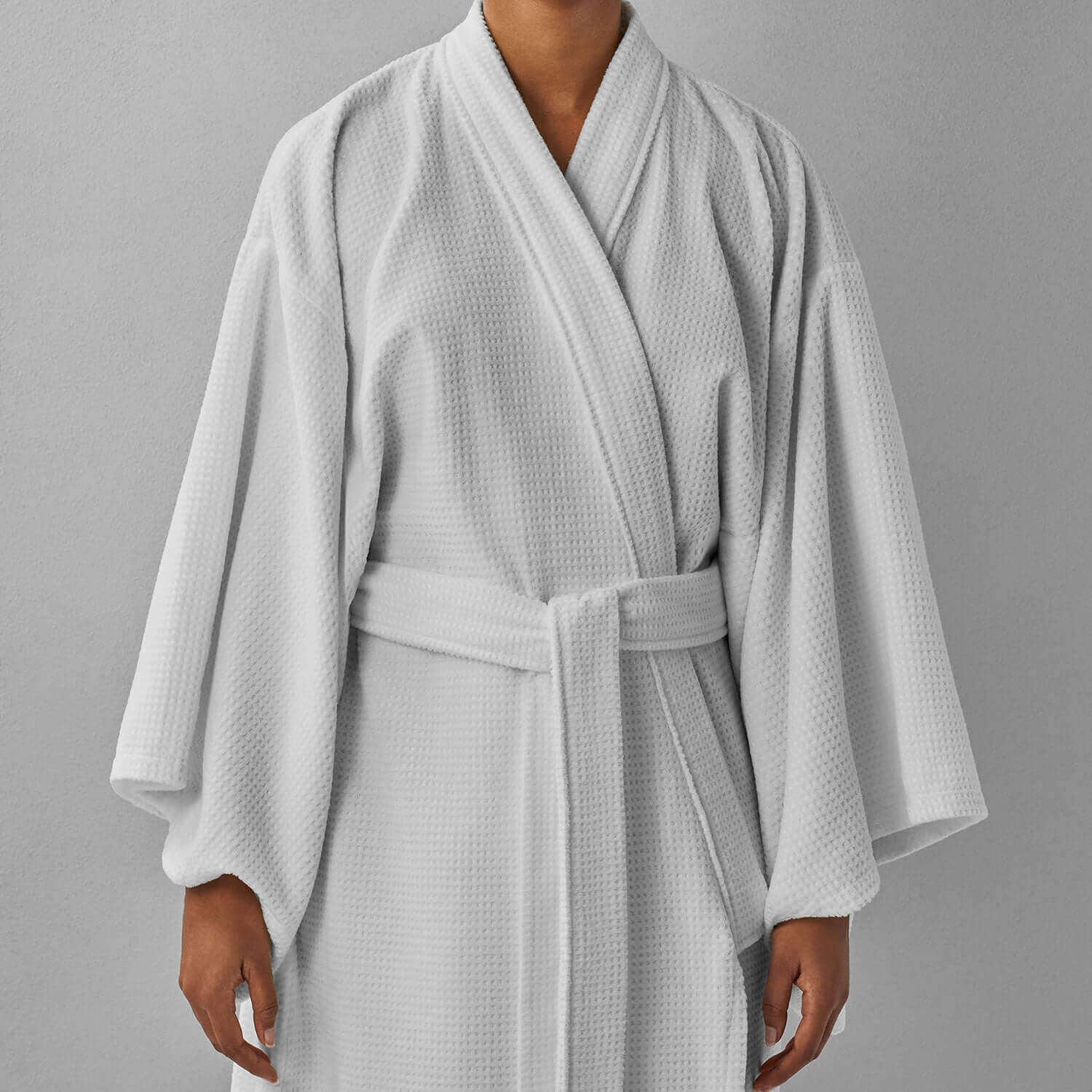 Luxurious Novotel Kimono in soft white velour with statement sleeves and hidden pockets.