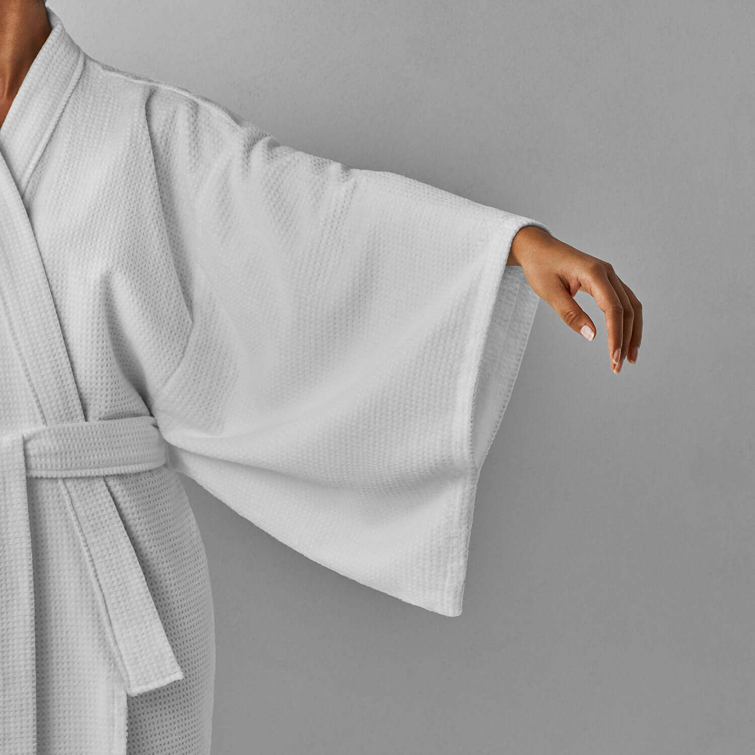 Luxurious Novotel Kimono in soft velour with statement sleeves and hidden pockets, perfect for spas and resorts.