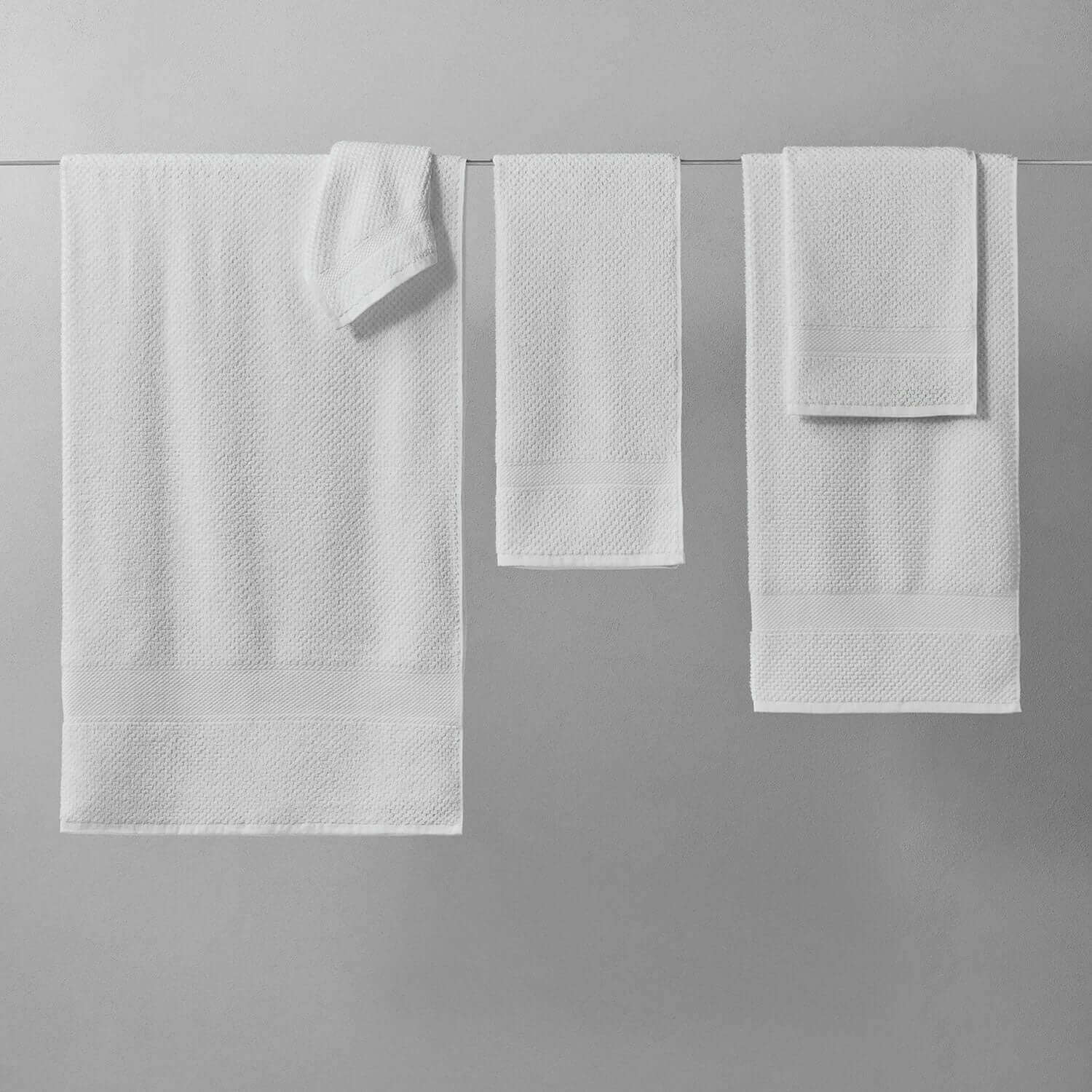 Novotel Towel set, featuring 100% Brazilian cotton in sporty luxury design, perfect for country clubs and yoga studios.