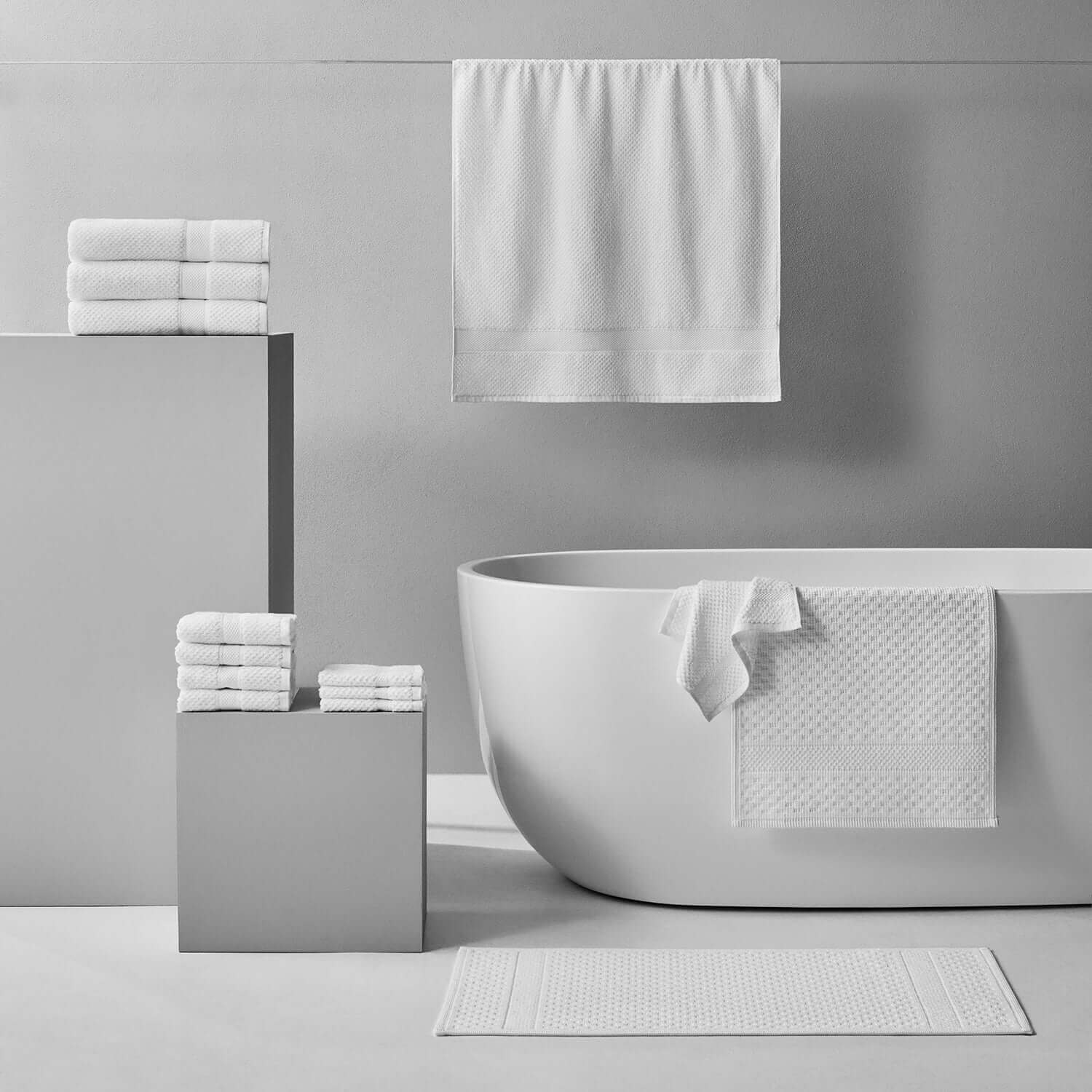 Elegant Novotel towels displayed in a modern bathroom setting, showcasing sporty luxury and performance.