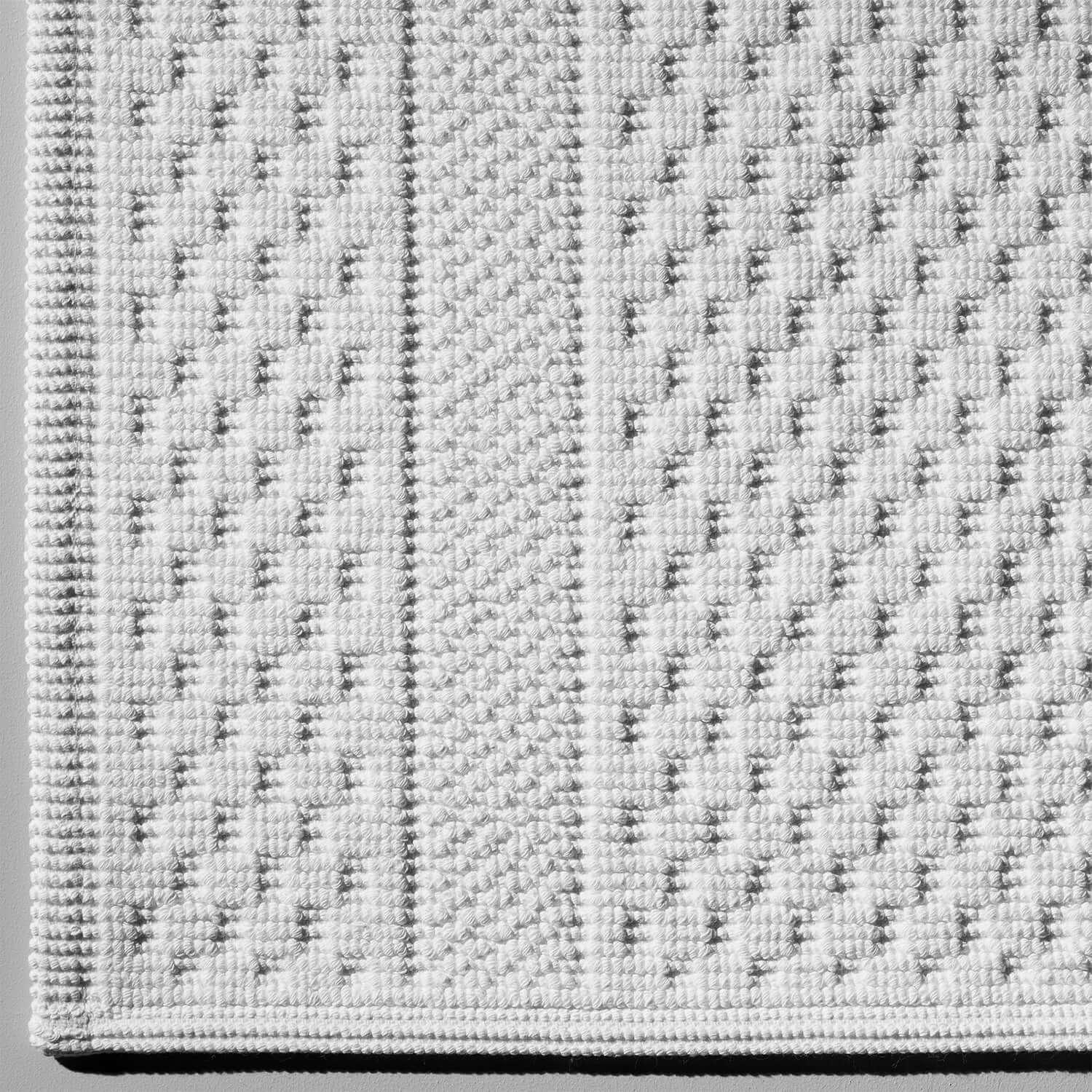 Textured dimpled pattern of Novotel towel made from 100% long-fibre Brazilian cotton, designed for high absorbency.