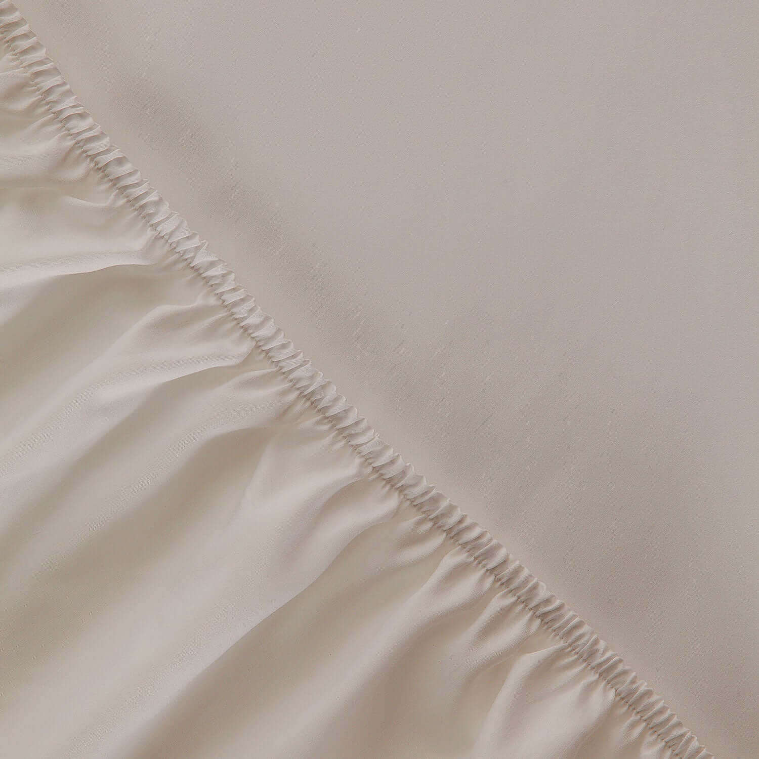 Sand fitted sheet showcasing silky texture, durable weave, ideal for spas and home massage therapists.