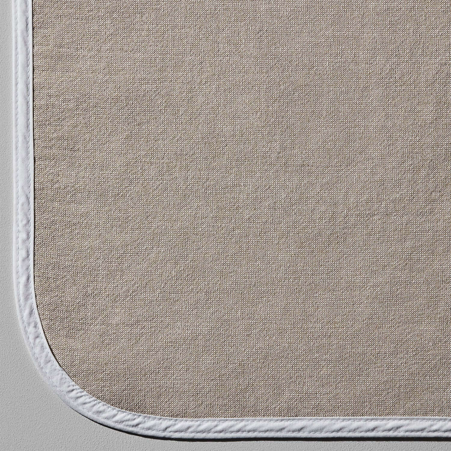Detail of the SOL Lounge Chair Cover in Sand, showcasing its elegant weave and secure-fit design.