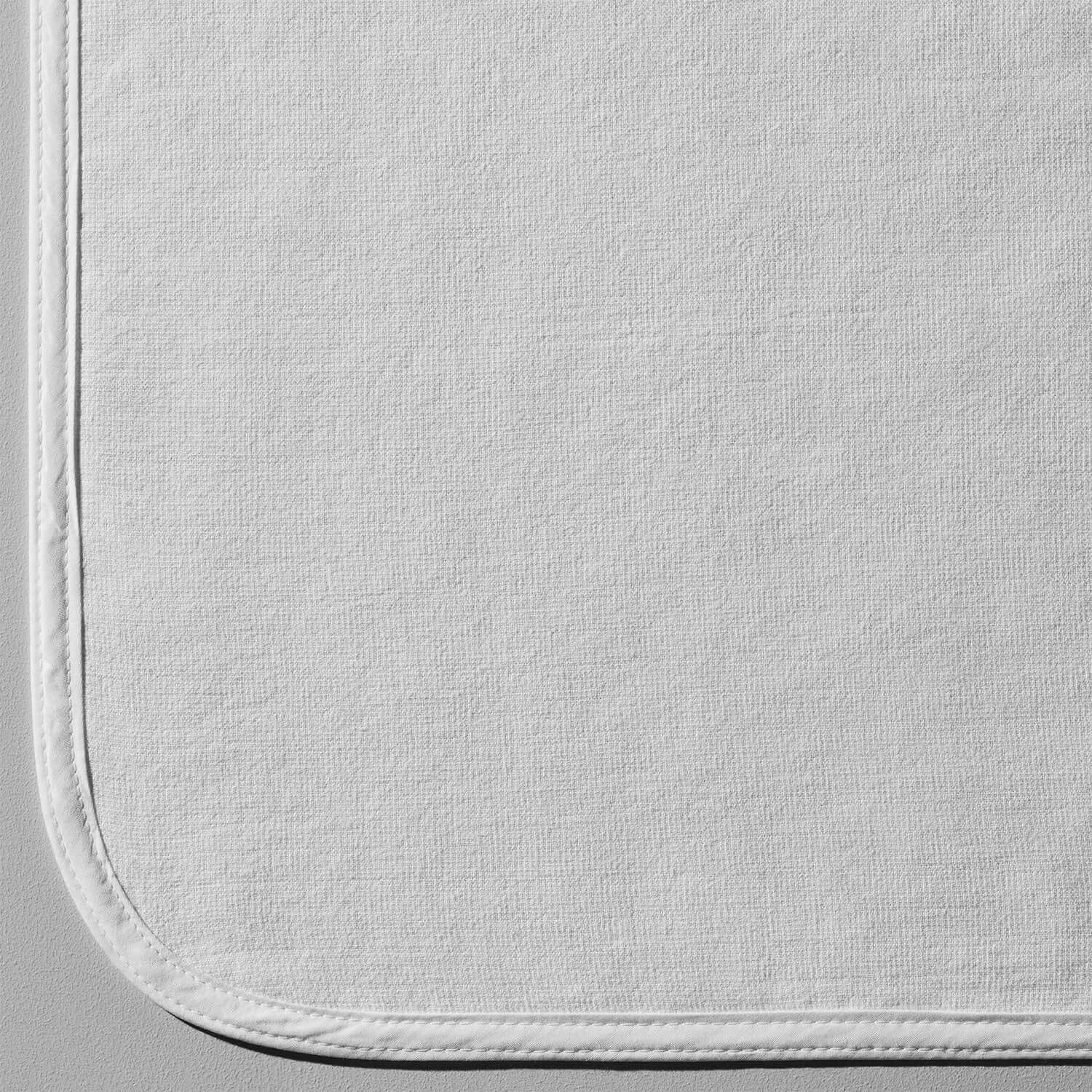 Close-up of a white SOL Lounge Chair Cover showcasing its soft texture and seamless edges.