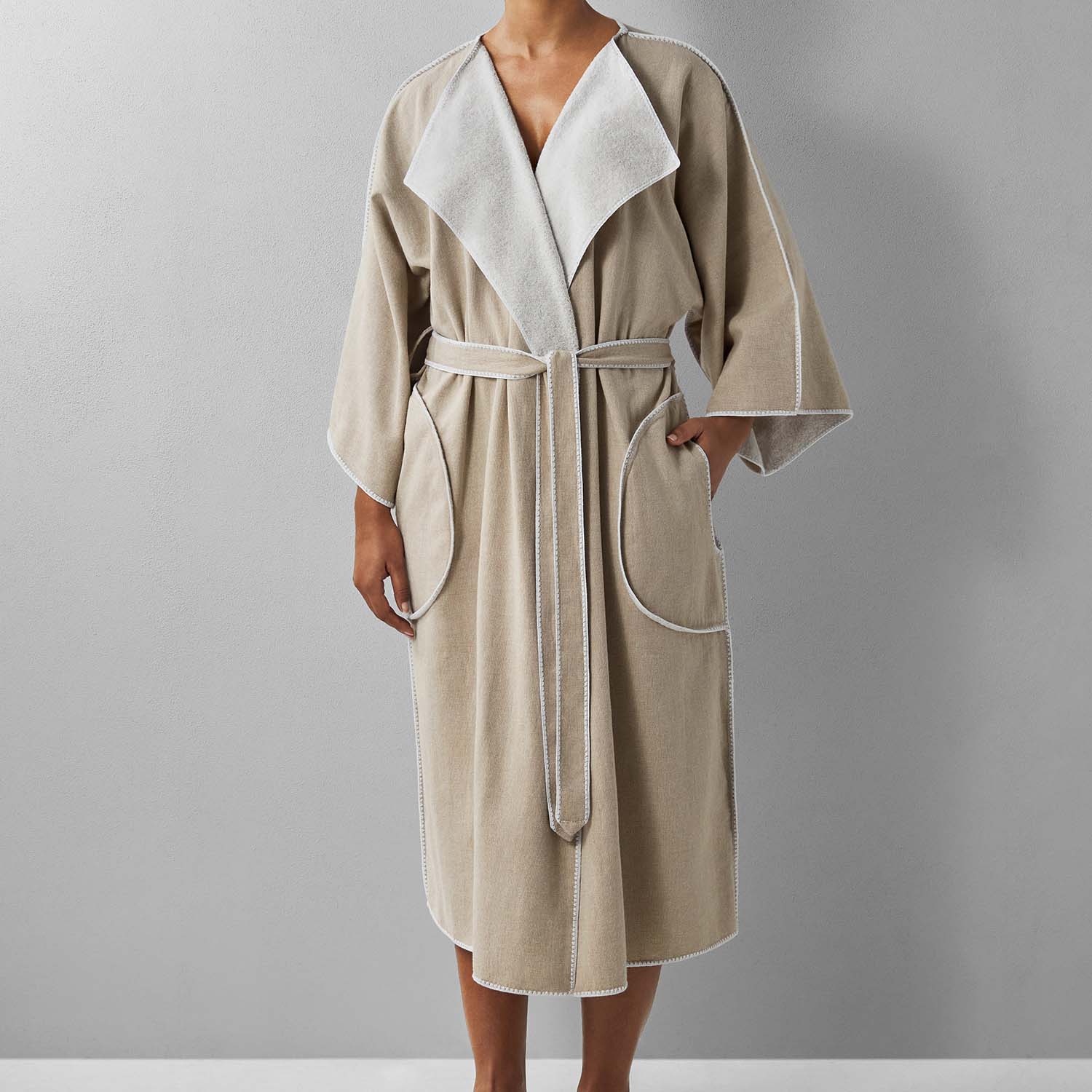 Eco-friendly SOL Robe Sand in soft terry, featuring cardigan lapel, ¾ sleeves, self-tie belt, and side pockets.