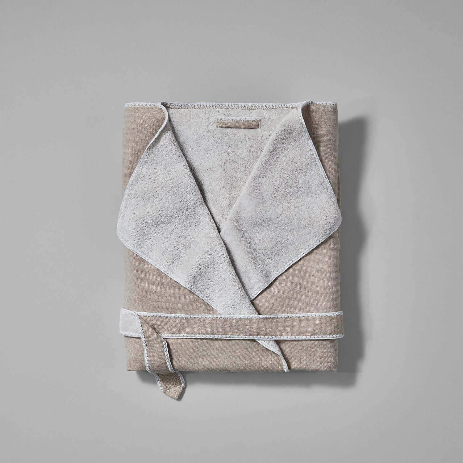 Folded SOL Robe Sand wholesale in soft terry, featuring cardigan lapel and self-tie belt, perfect for a stylish lifestyle.