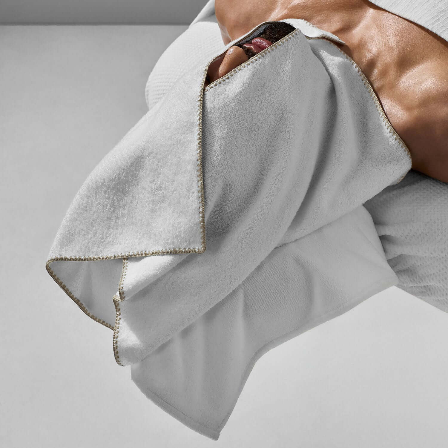 Luxurious Bordado Facial Towel in sand trim, ideal for professional facial care and daily self-care rituals.