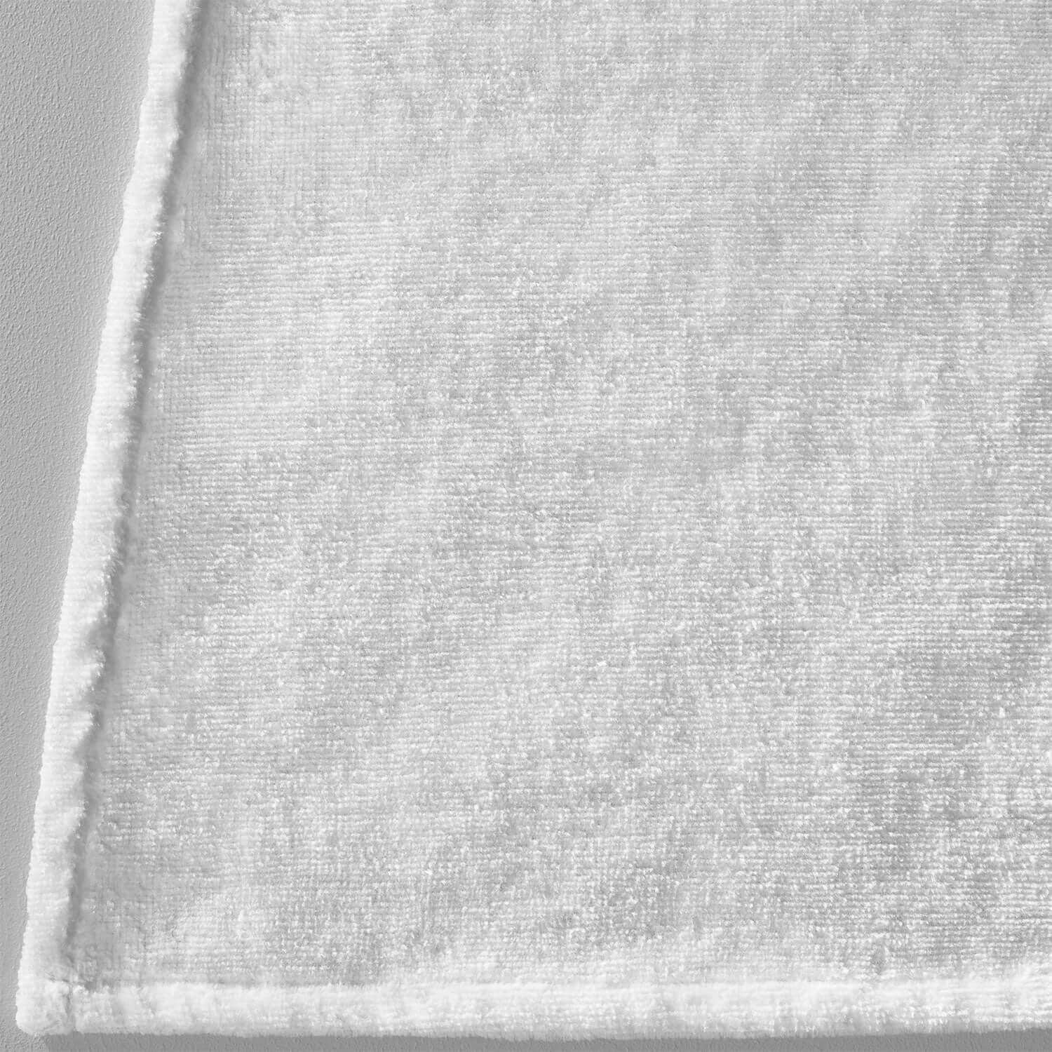 Soft white cotton terry velour fabric ideal for massage cradle covers, providing comfort and luxury for spa experiences.