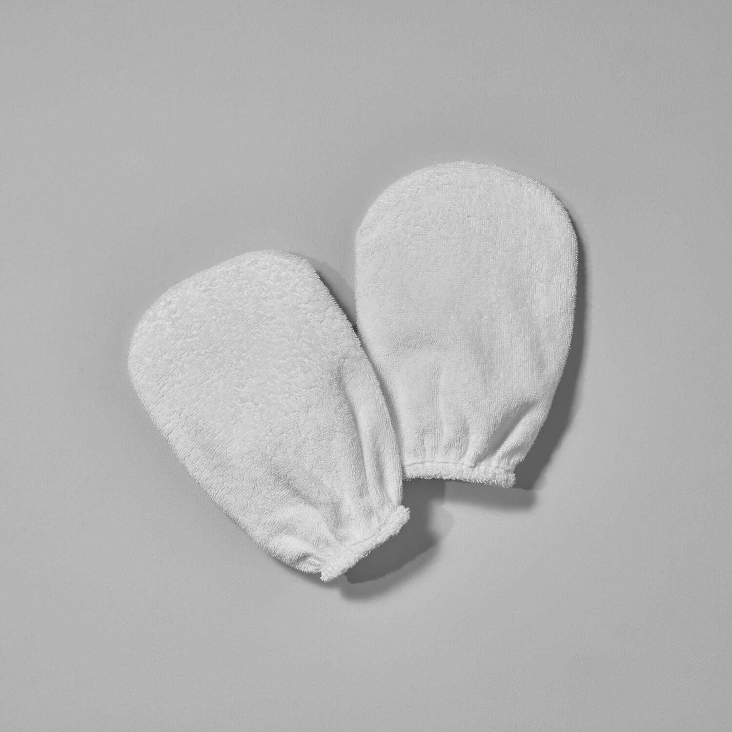 Ultra-soft cleansing mitts for gentle facial cleansing and body exfoliation, ideal for spas and hotels.