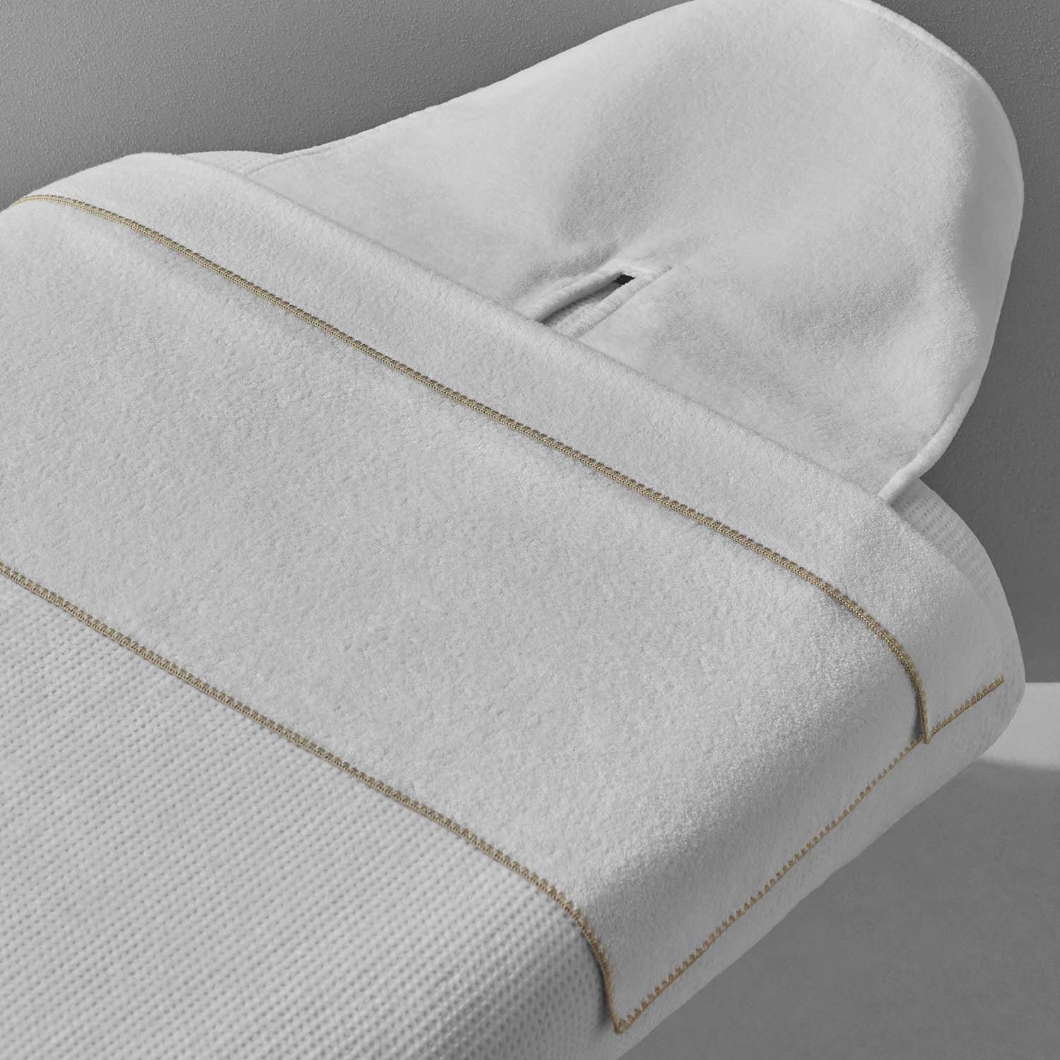 Luxurious Bordado Facial Towel with elegant sand trim, designed for spa-quality face treatments. Soft 100% combed cotton.