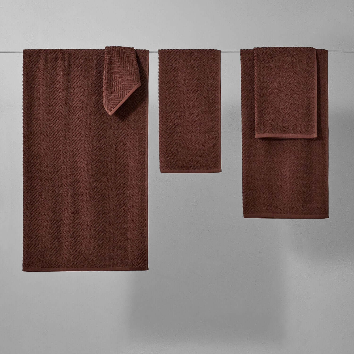 Treatment Towel Bruno Wholesale in rich brown, designed for spa treatments with a sophisticated herringbone pattern.