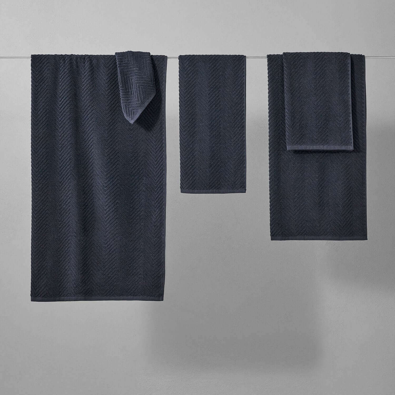 Slate treatment towels in herringbone pattern, ideal for spas and mud treatments, showcasing depth of color and durability.