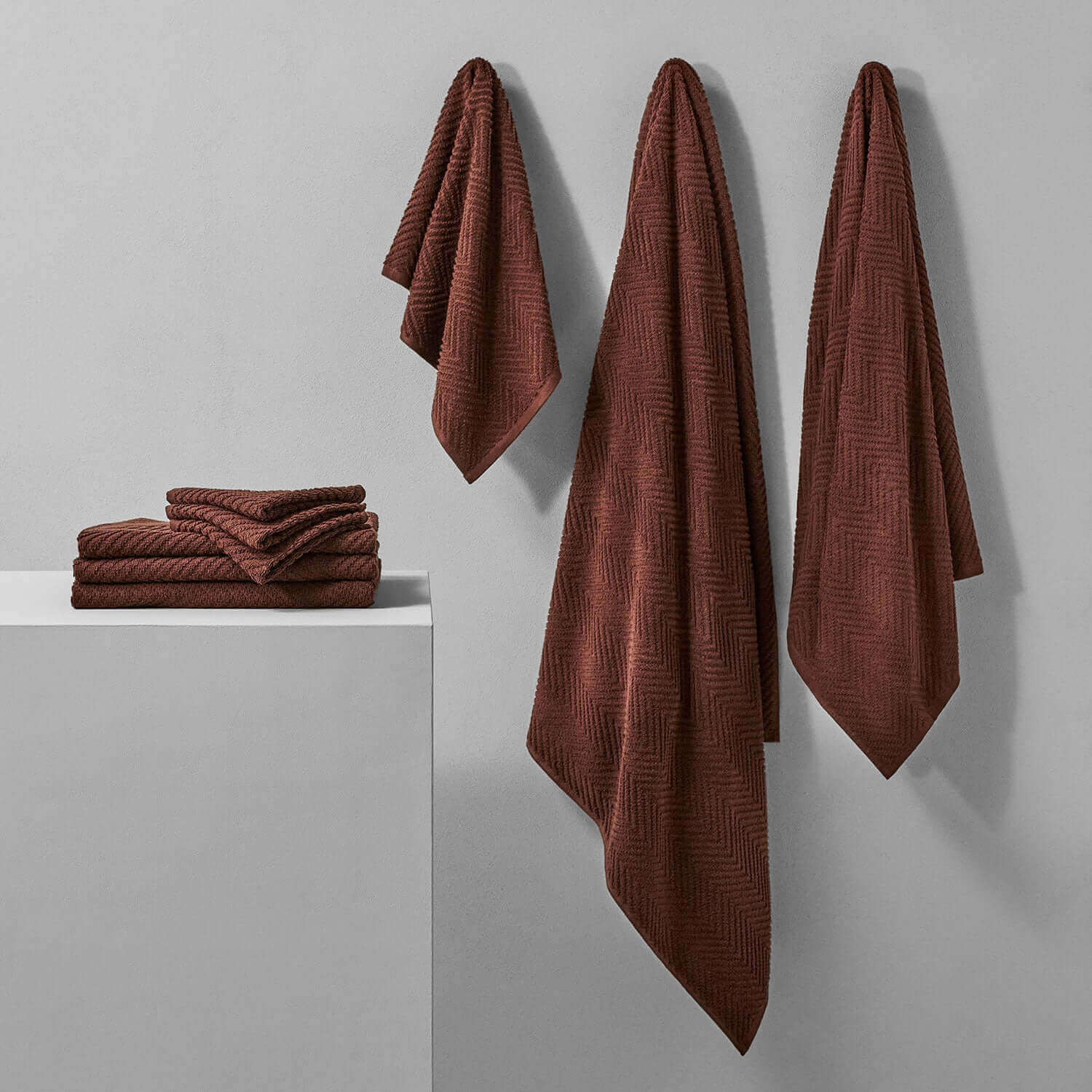 Bruno Treatment Towels in deep brown, showcasing rich color and texture, perfect for spa treatments and durable against bleach.