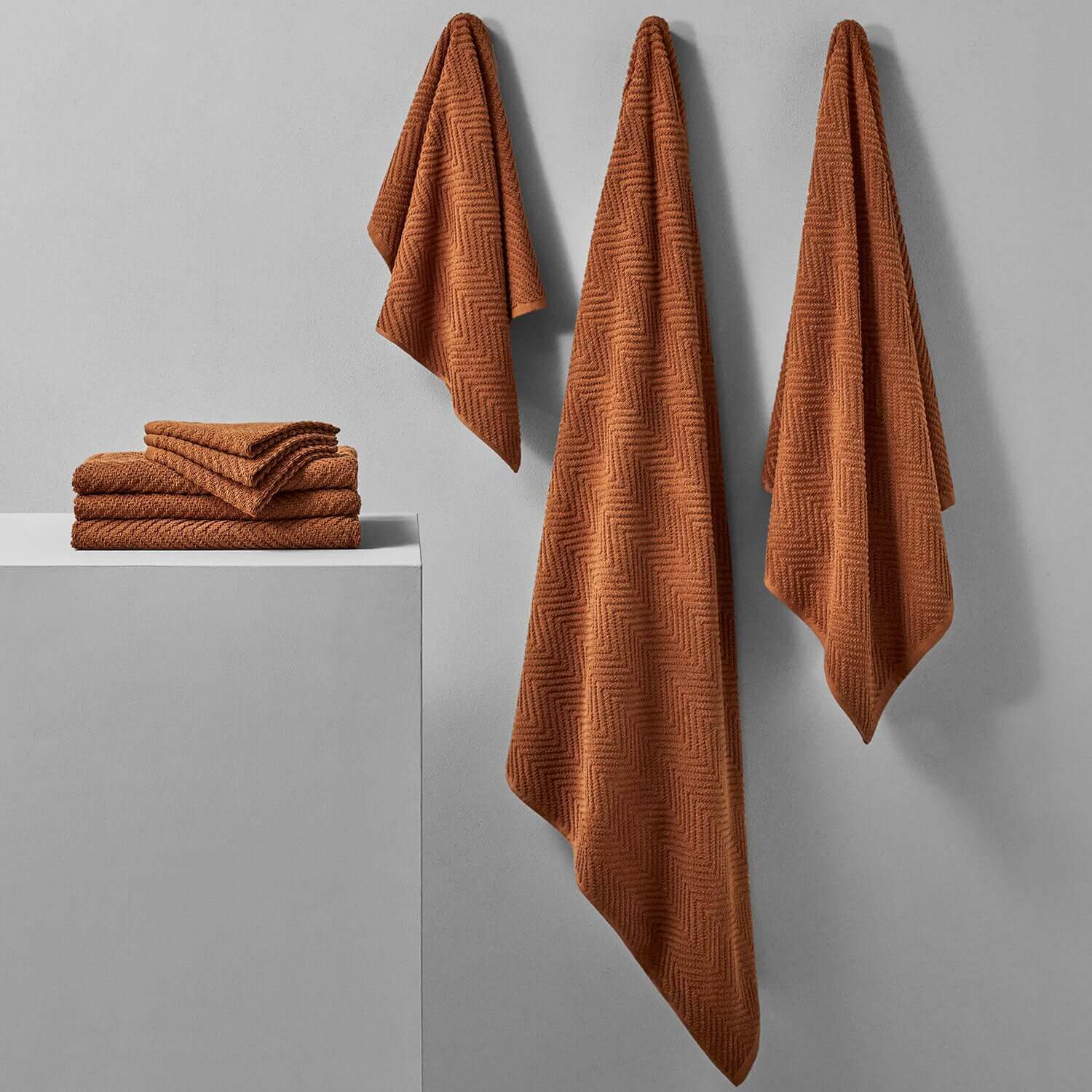 Treatment towels in earthy tones, ideal for clay and mud treatments in spas, featuring specialized dye for durability.