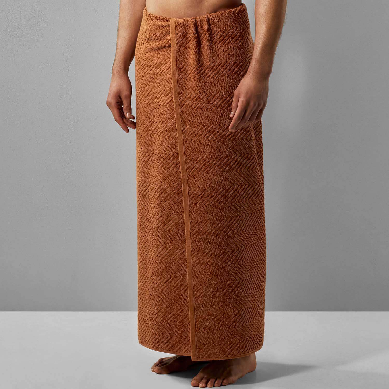 Treatment towel in clay color, designed for spa and wellness treatments with bleach-resistant dye, showcasing a textured design.