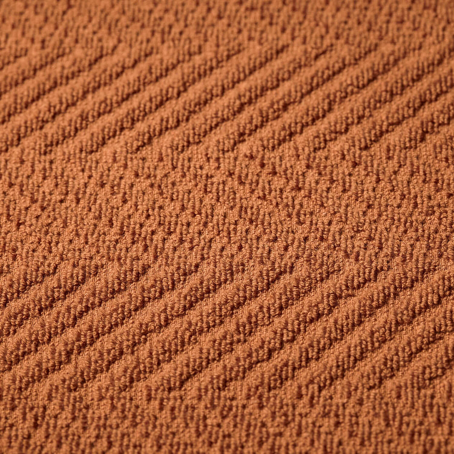 Textured clay treatment towel in warm brown, perfect for spa and wellness applications, suitable for bleach use.