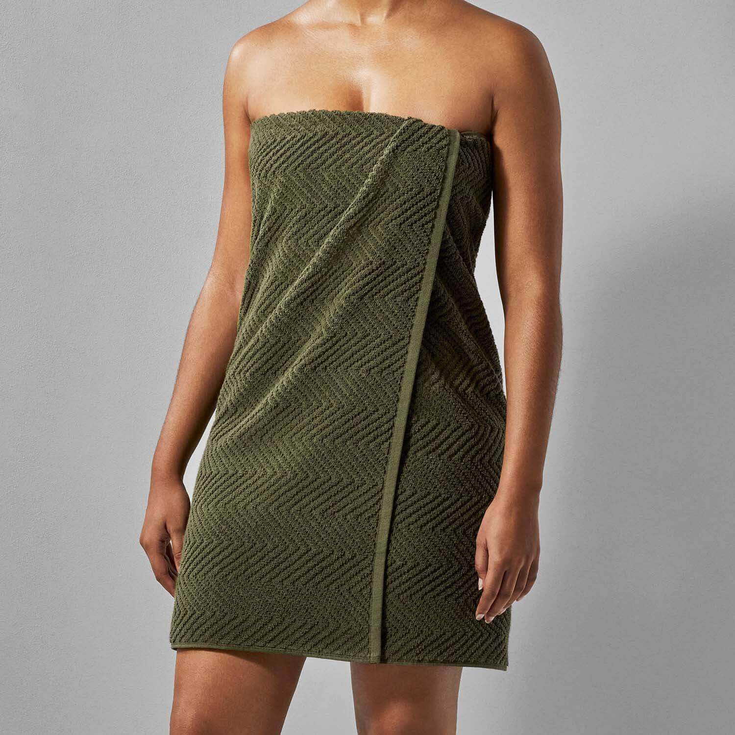 Olive treatment towel designed for spa use, showcasing a textured pattern, perfect for bath, shower, or pool treatments.