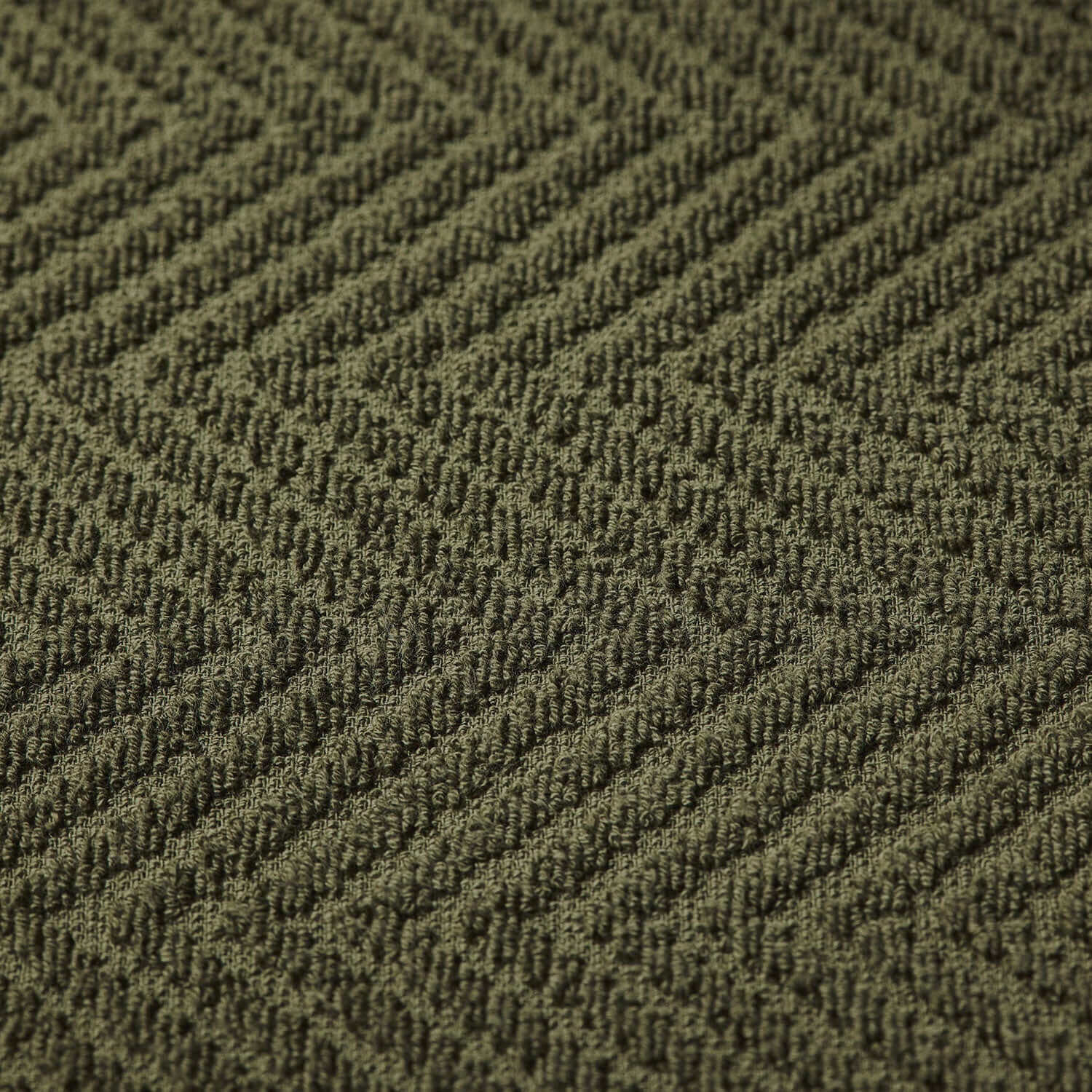 Olive treatment towel with a herringbone pattern, ideal for spa use and colorfast with bleach.