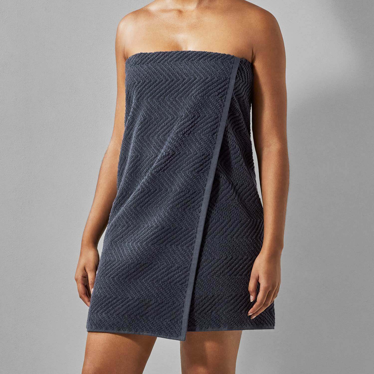Slate treatment towel designed for spa and wellness use, evoking elements of water and earth, bleach-friendly and vibrant.