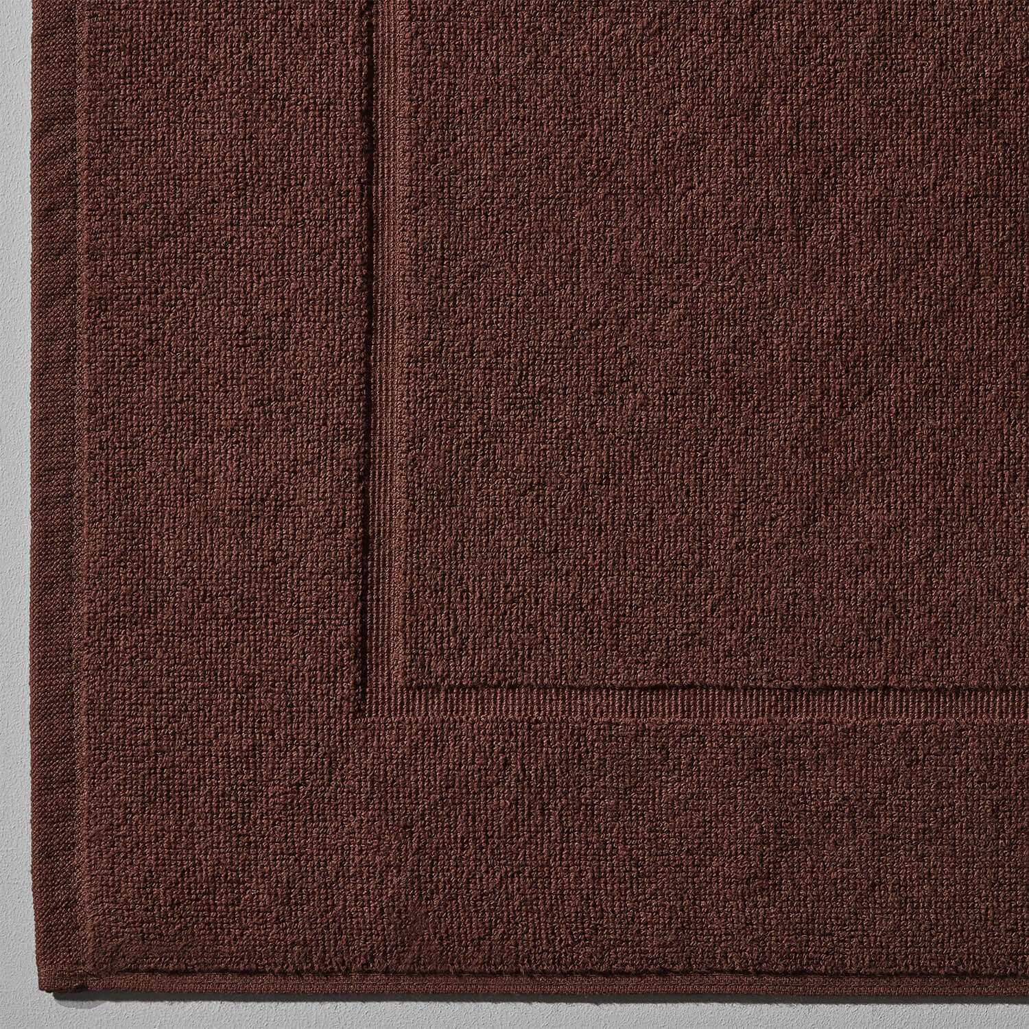 Close-up of the brown Treatment Mat Bruno, featuring innovative blotch resistant texture, ideal for spas and households.
