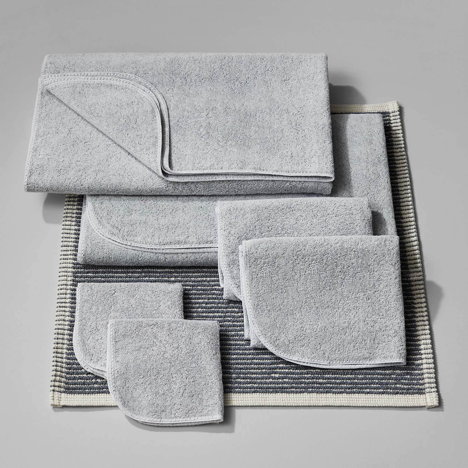 Tuxedo Bath Bundle in gray, featuring sustainably sourced towels and mats for an eco-friendly bathroom.