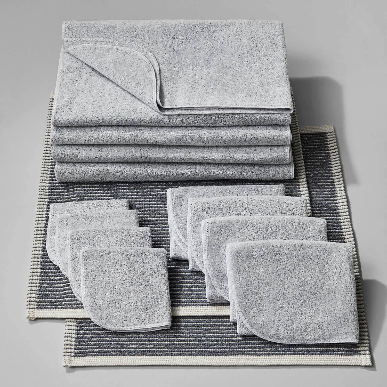 Tuxedo Bath Bundle Gray featuring eco-friendly towels and mats made from sustainably farmed Brazilian cotton.