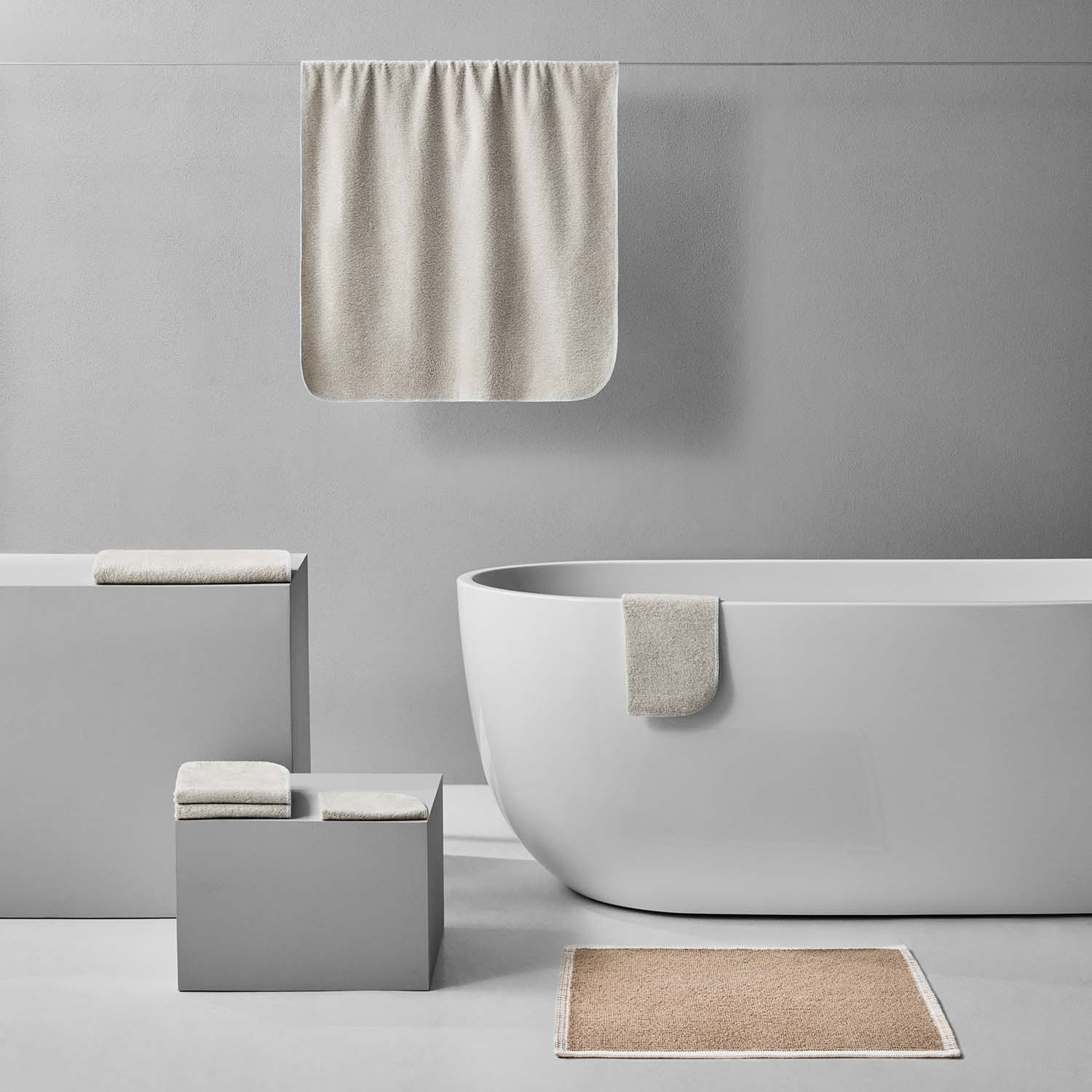Elegant Tuxedo Bath Bundle in sand, featuring eco-luxury towels and mats for a modern bathroom aesthetic.