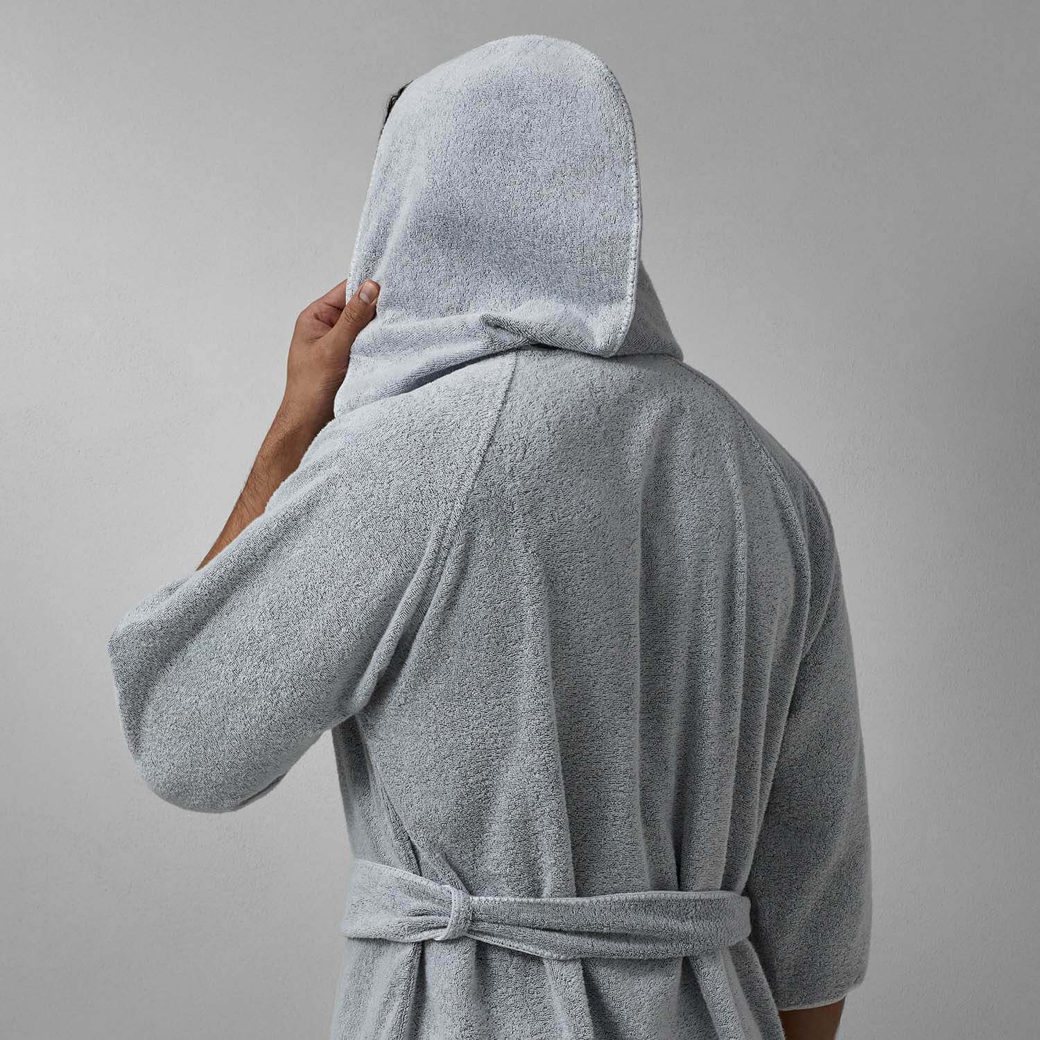 Back view of a man wearing a Tuxedo Hooded Gray robe with a self-tie belt, showcasing its sleek, elegant design.
