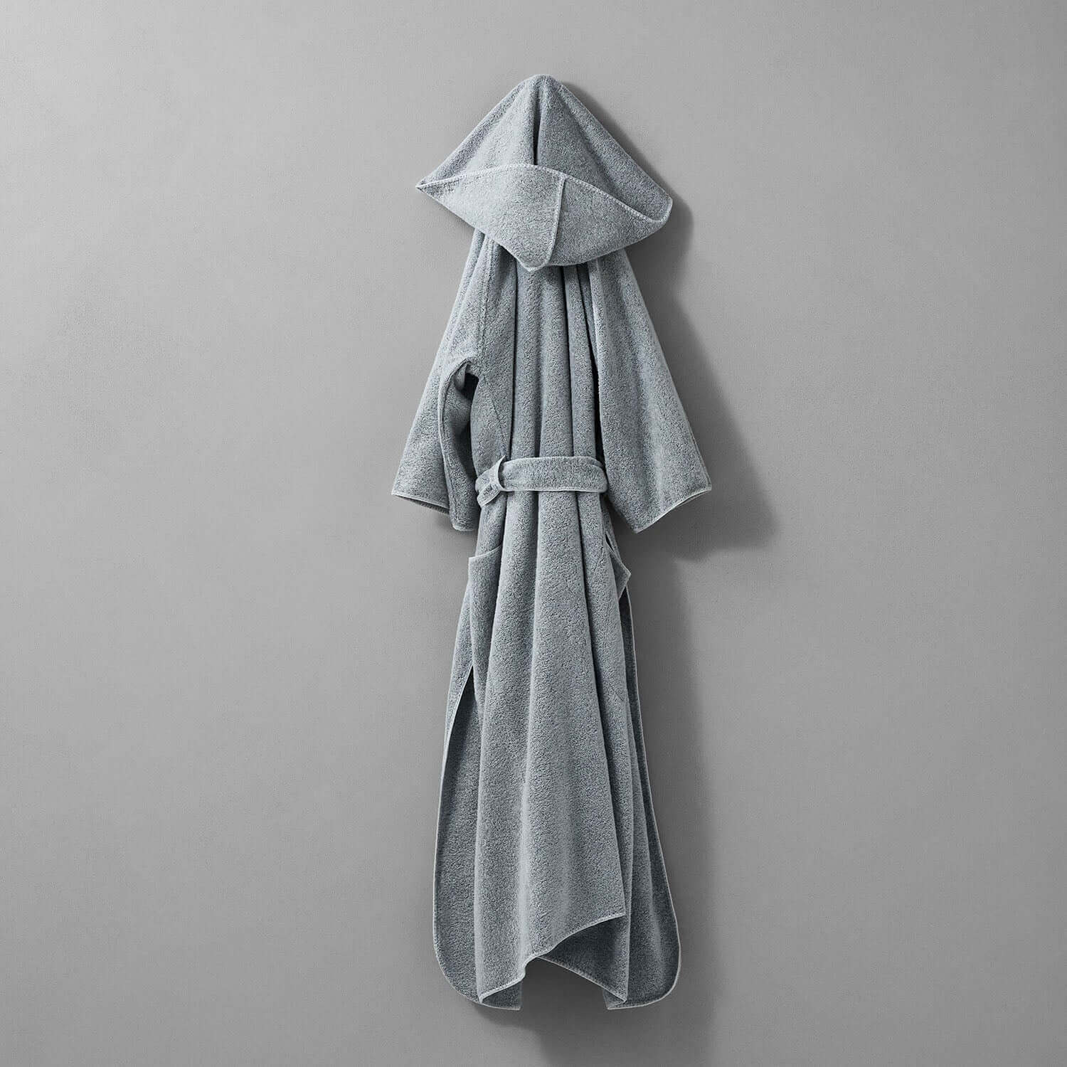 Hooded gray tuxedo robe with self-tie belt, showcasing sleek design and rounded finishes, perfect for stylish comfort.