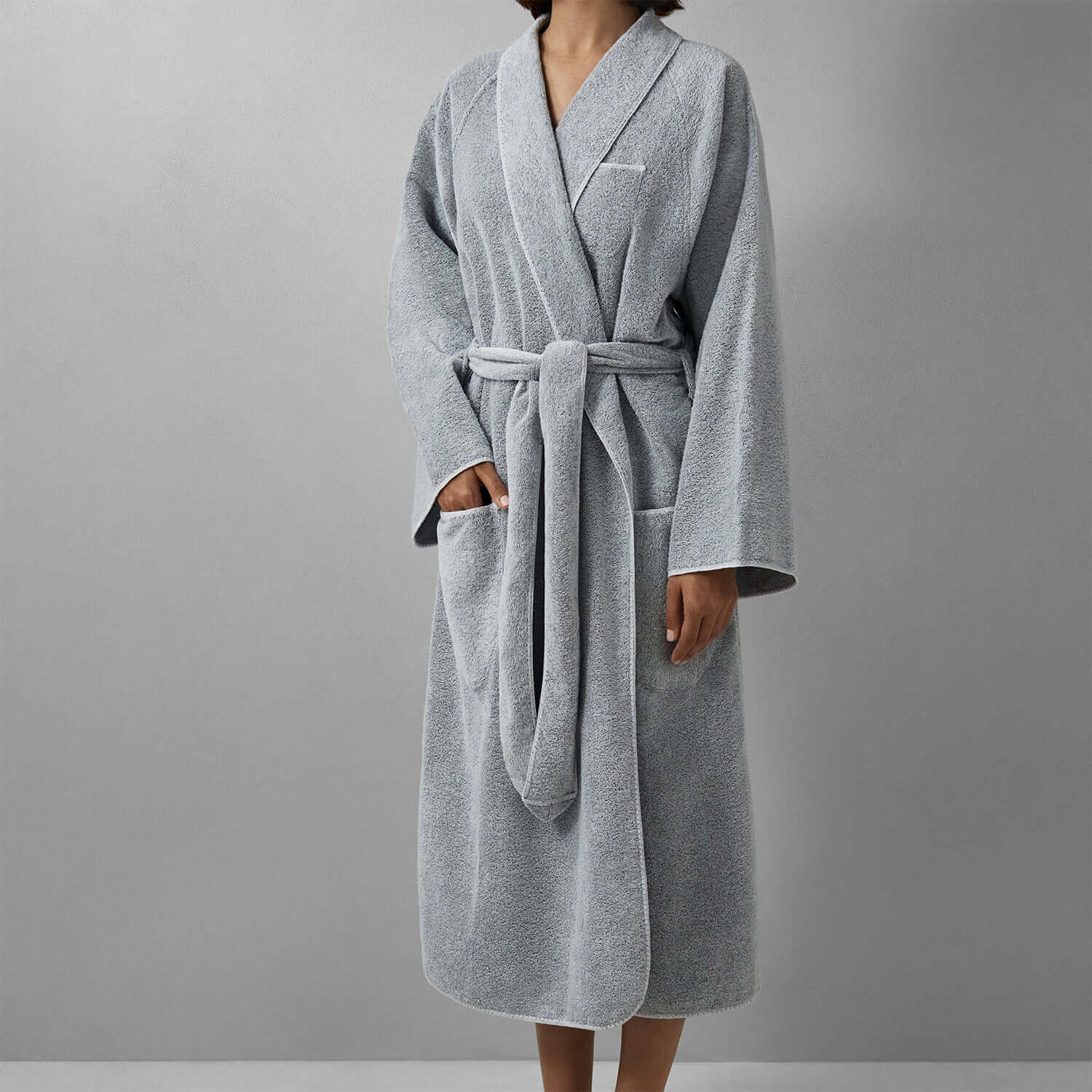 Sleek gray tuxedo shawl robe with softly rounded hem and tie belt, perfect for a chic, unisex look.