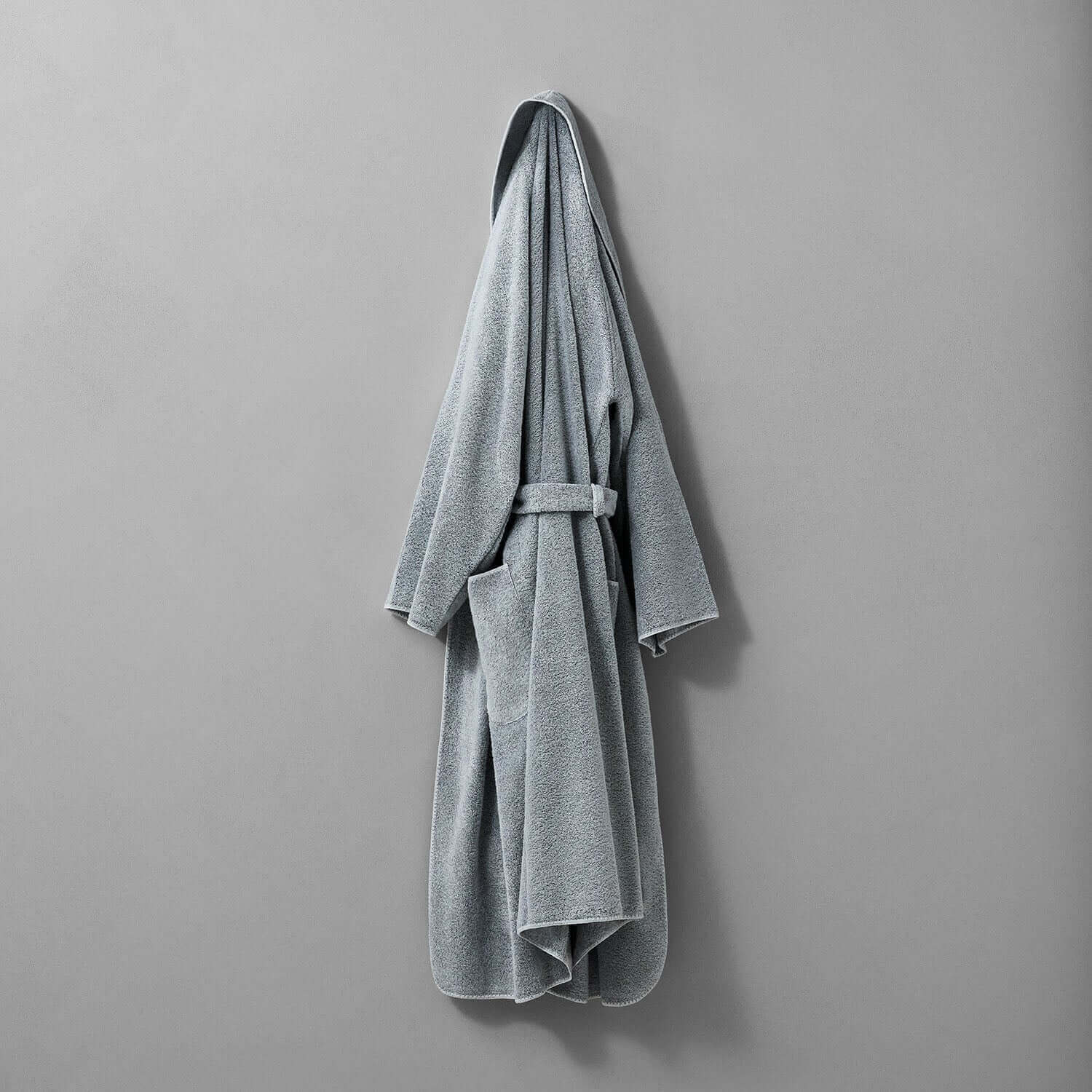 Elegant gray tuxedo shawl robe featuring softly rounded finishes and self-tie belt, perfect for chic, unisex style.