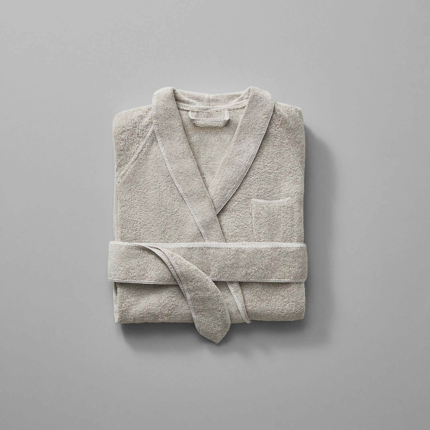 Tuxedo Shawl Sand bathrobe in millennial grey with silver accents, elegantly unisex design, perfect styling for luxury settings.